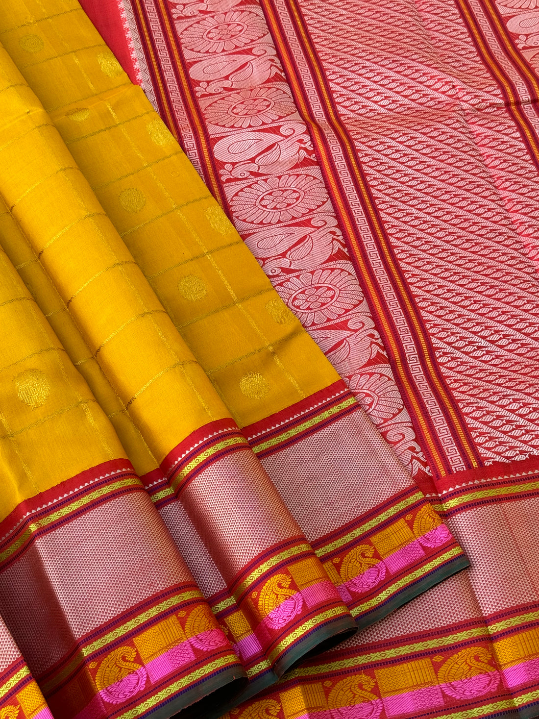 A stunner handwoven golden yellow shade with deep red Korvai kanchivaram silk saree with zari veldhari kattam
