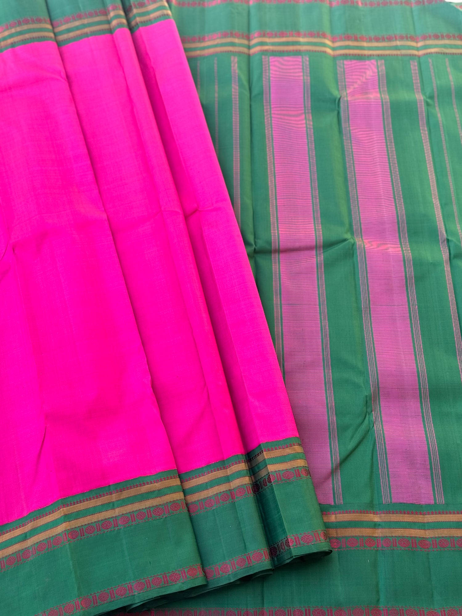 A subtle handwoven pattu rose pink shade with green Threadwork Kai korvai kanchivaram silk saree