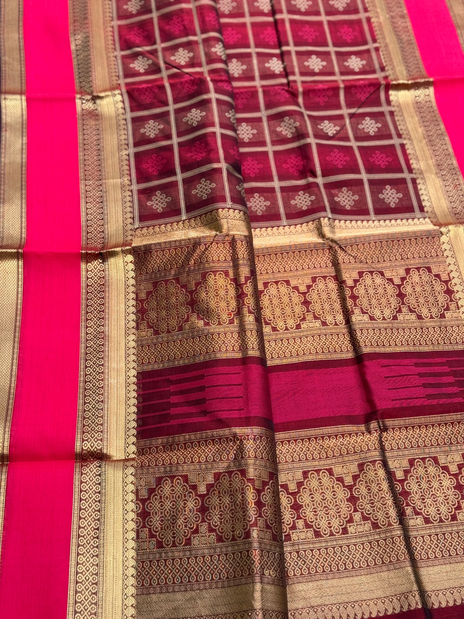 A gorgeous burgundy shade handwoven kolam buttas  silk cotton saree