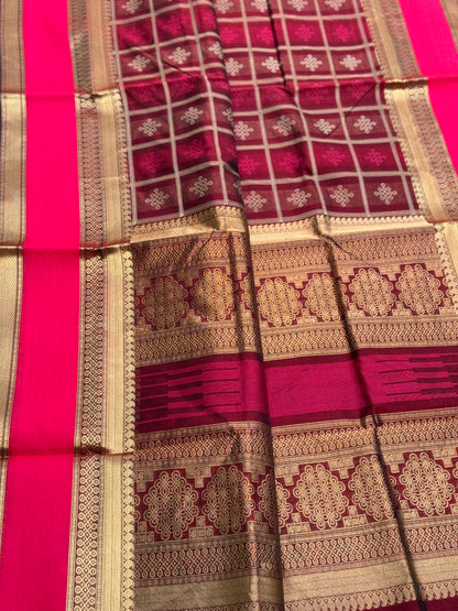 A gorgeous burgundy shade handwoven kolam buttas  silk cotton saree