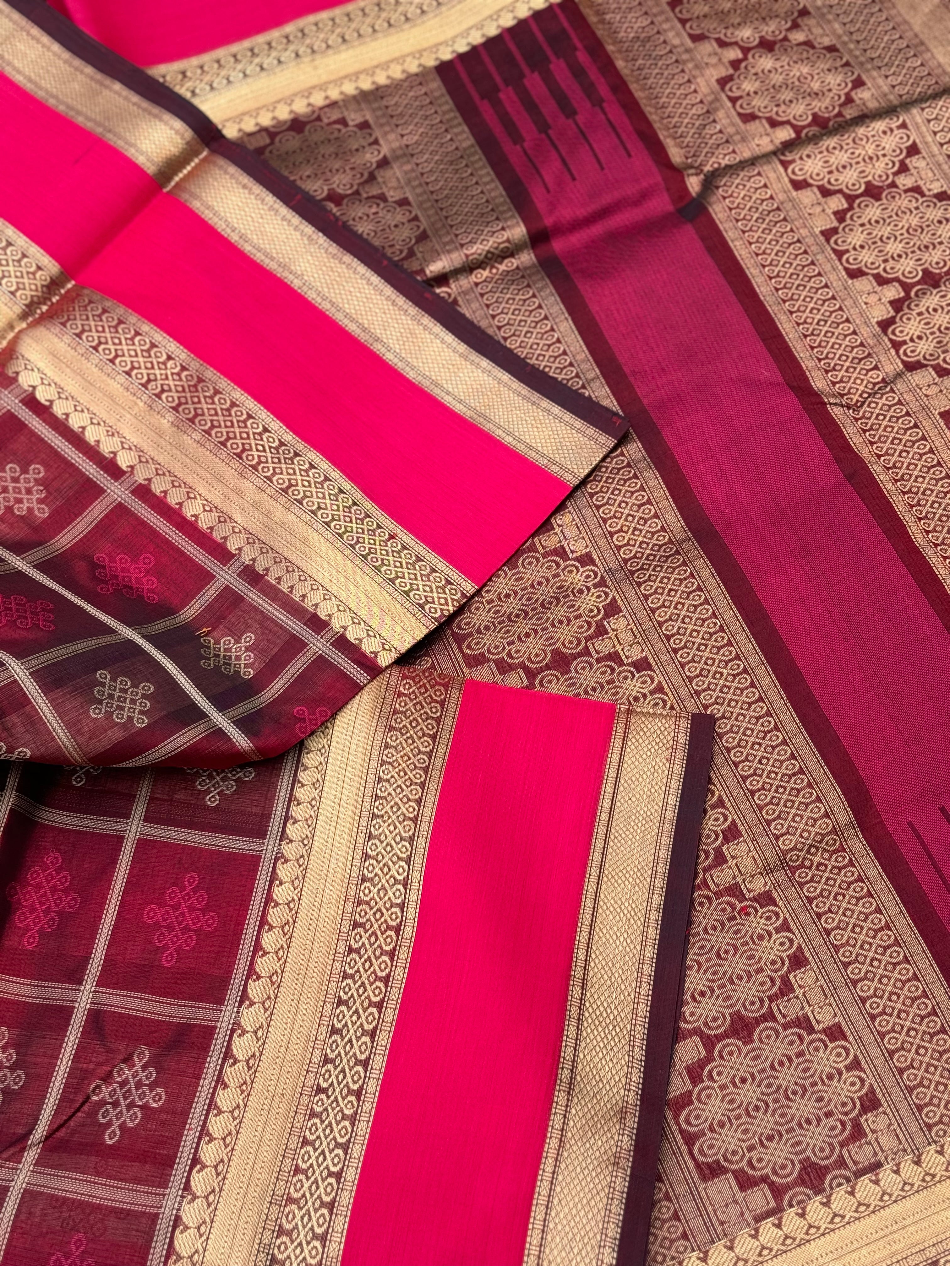 A gorgeous burgundy shade handwoven kolam buttas  silk cotton saree