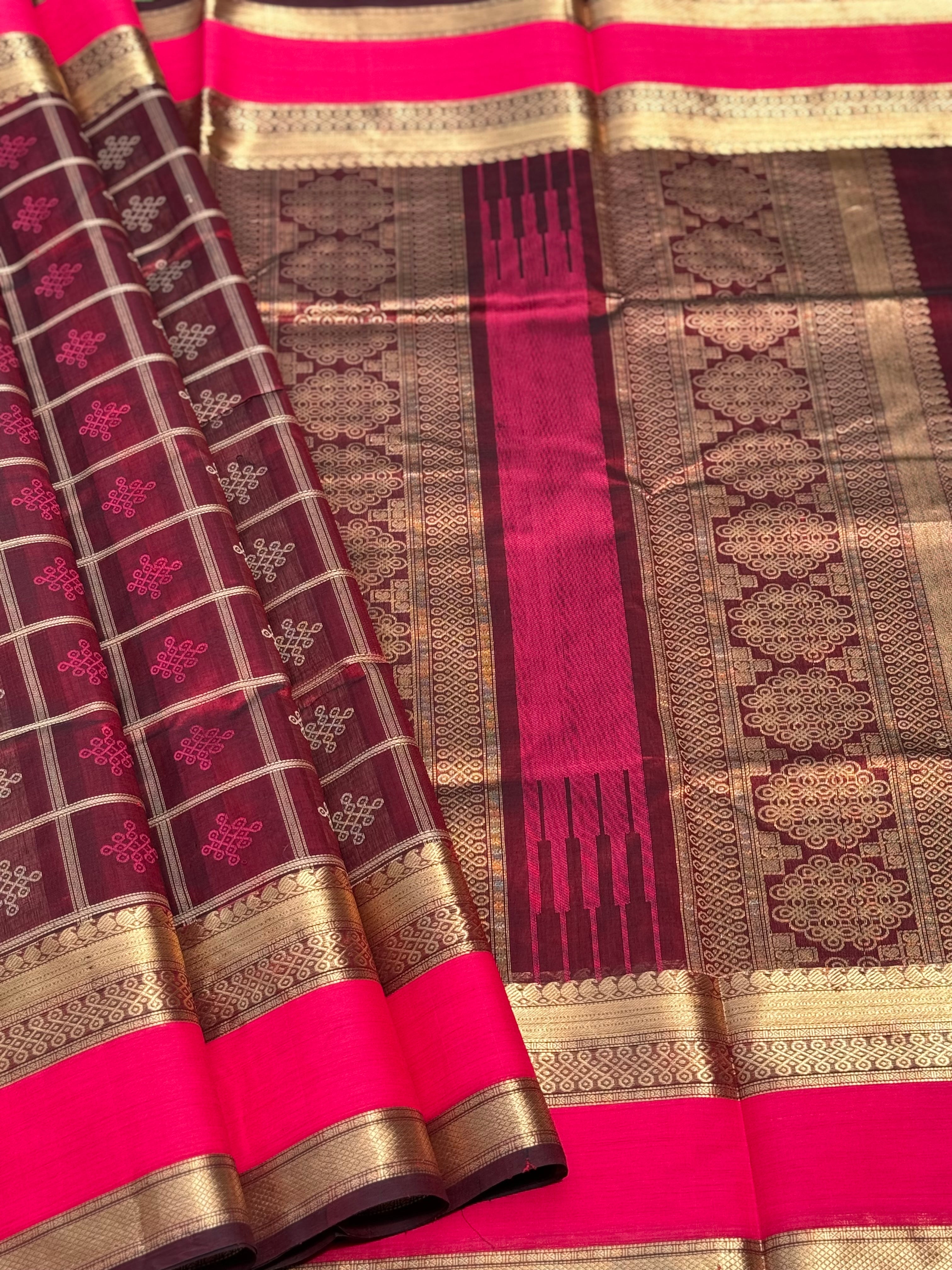 A gorgeous burgundy shade handwoven kolam buttas  silk cotton saree