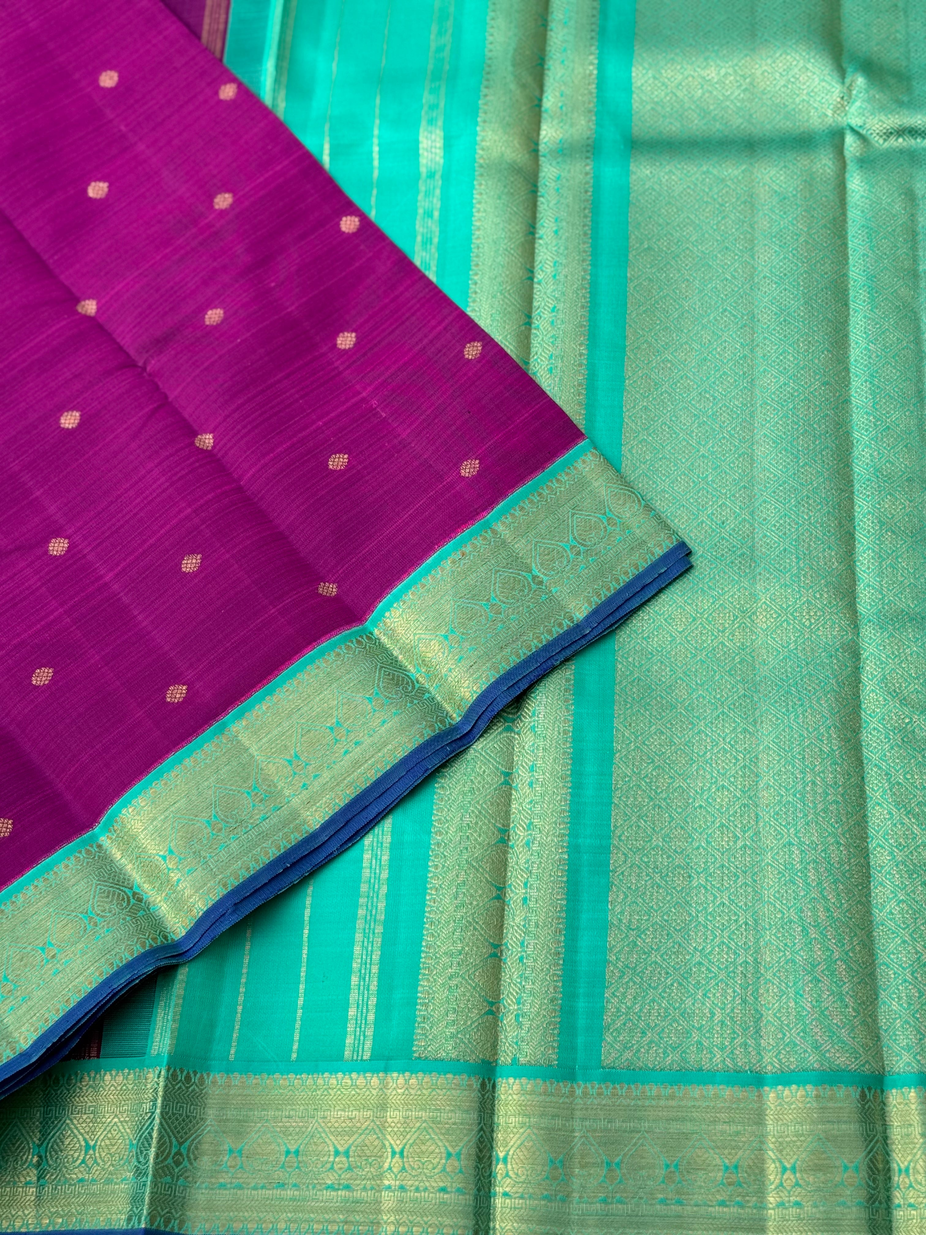 A Masterpiece kanchivaram korvai silk saree in deep plum pink with turquoise foam green