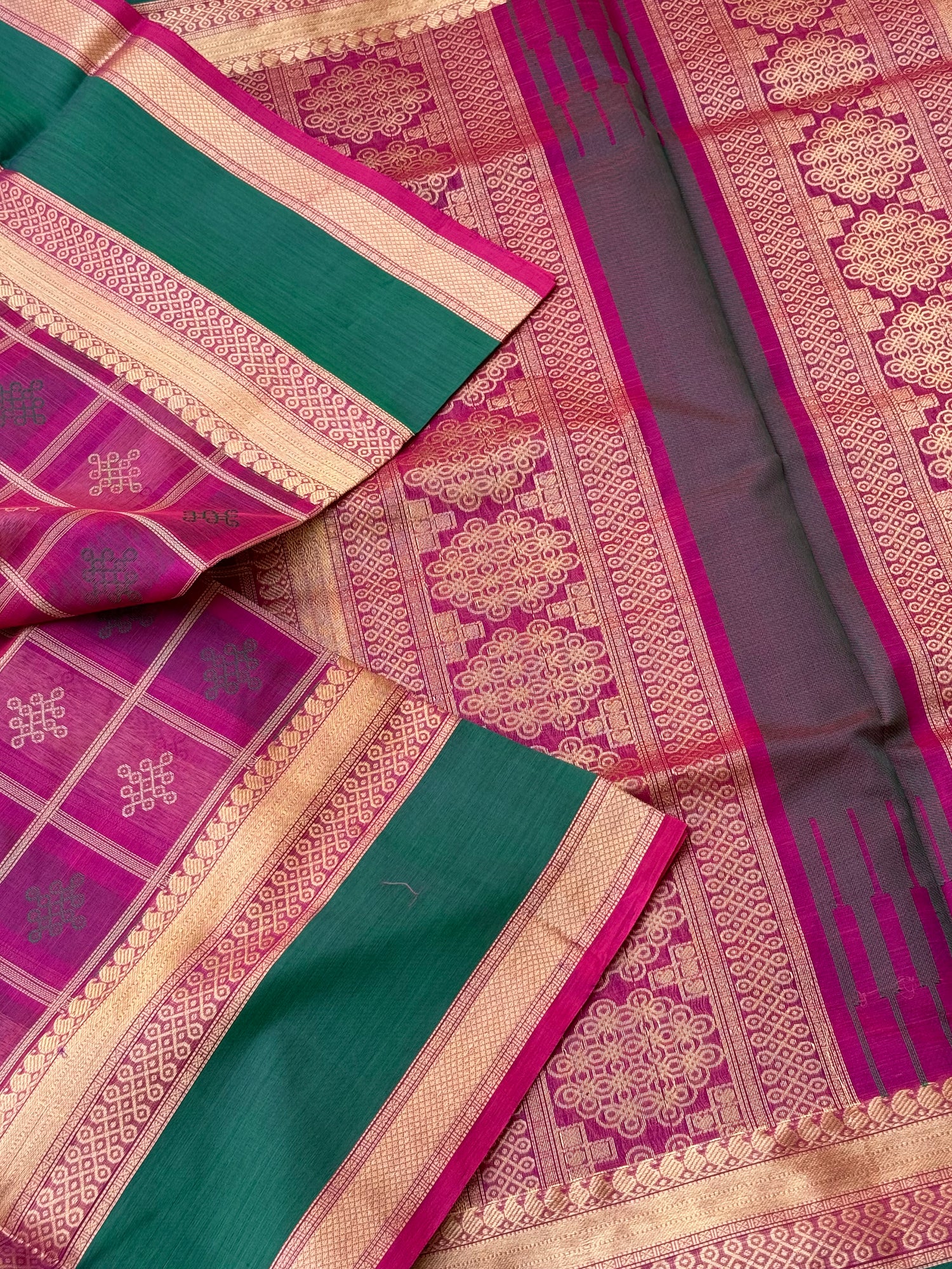 A gorgeous majenta shade handwoven kolam buttas  silk cotton saree