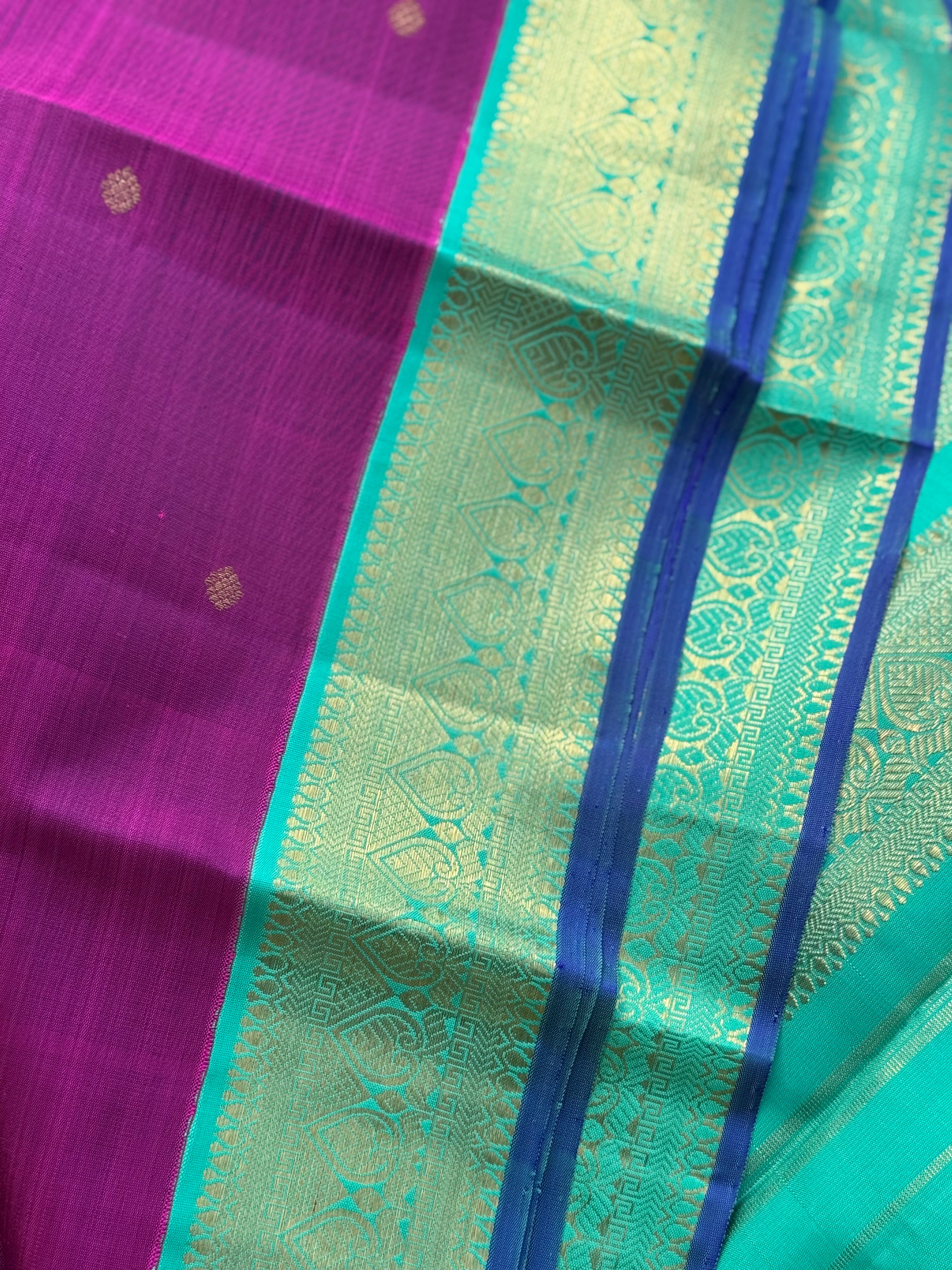 A Masterpiece kanchivaram korvai silk saree in deep plum pink with turquoise foam green