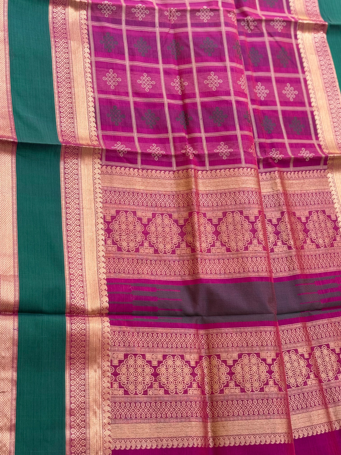 A gorgeous majenta shade handwoven kolam buttas  silk cotton saree