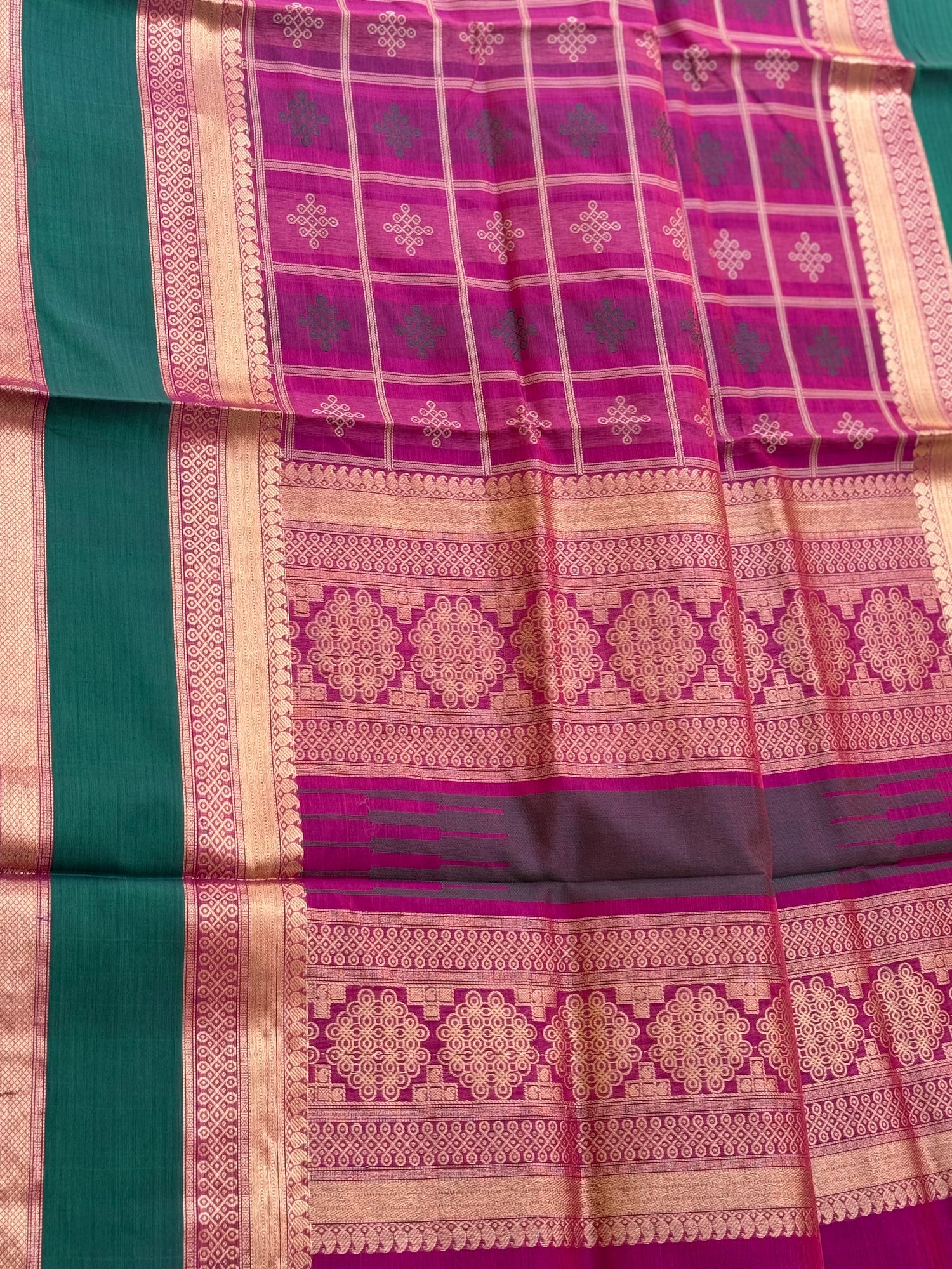 A gorgeous majenta shade handwoven kolam buttas  silk cotton saree