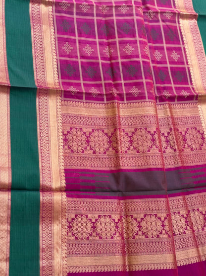 A gorgeous majenta shade handwoven kolam buttas  silk cotton saree