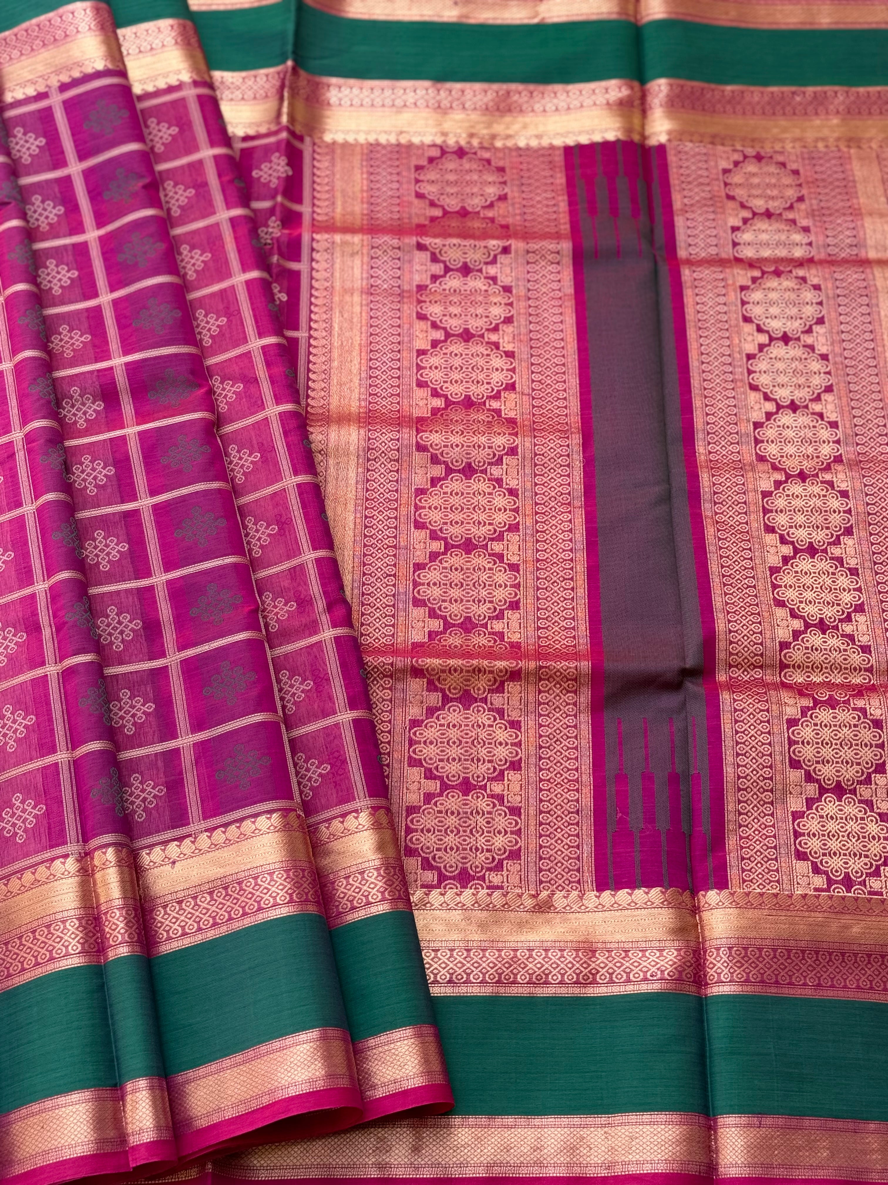 A gorgeous majenta shade handwoven kolam buttas  silk cotton saree