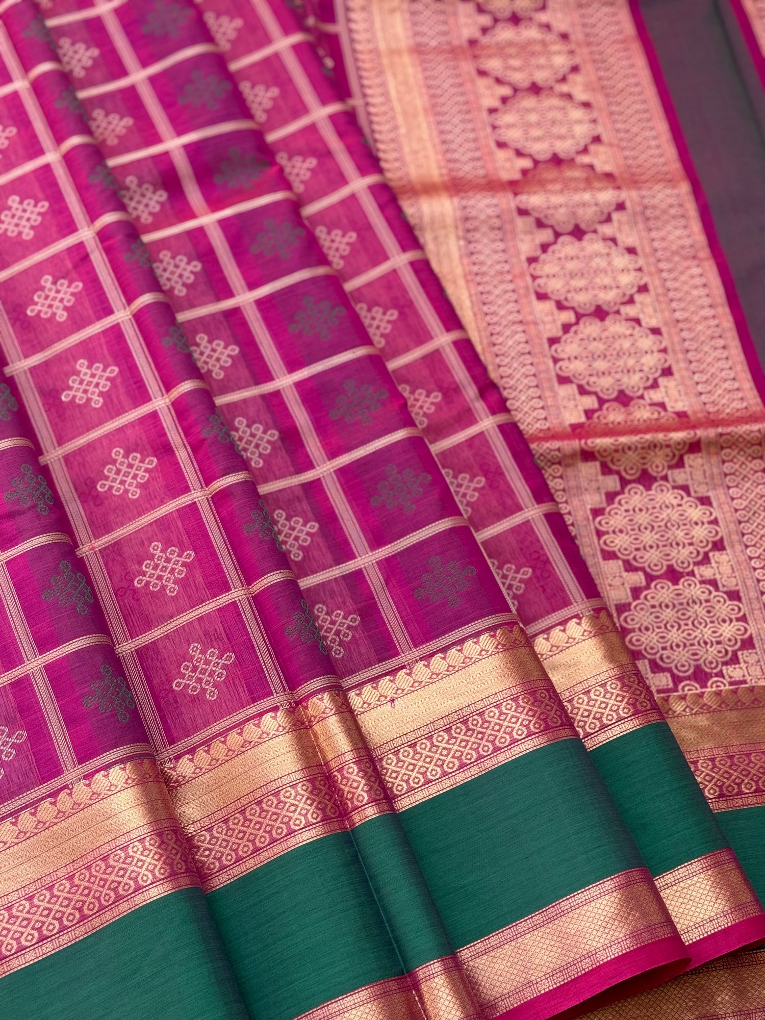 A gorgeous majenta shade handwoven kolam buttas  silk cotton saree