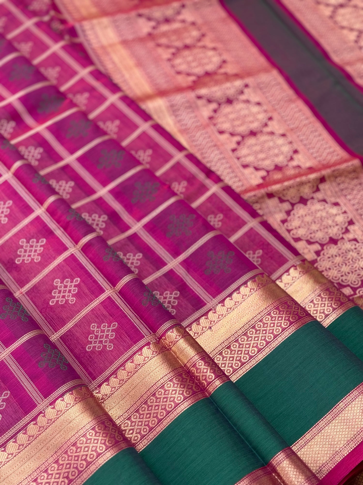 A gorgeous majenta shade handwoven kolam buttas  silk cotton saree