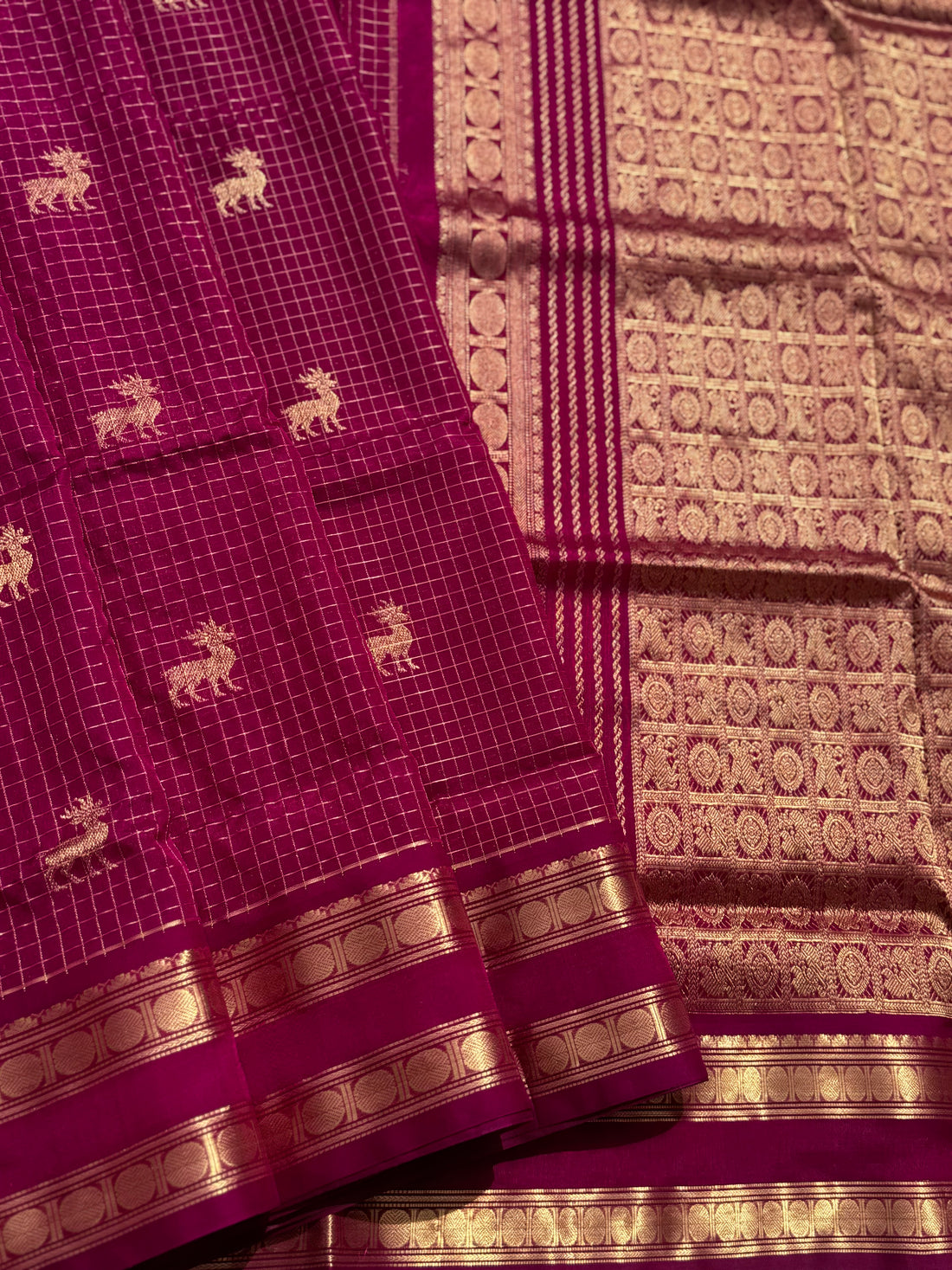 A gorgeous deep pink shade handwoven zari checks with deer motifs Kanchi silk cotton saree