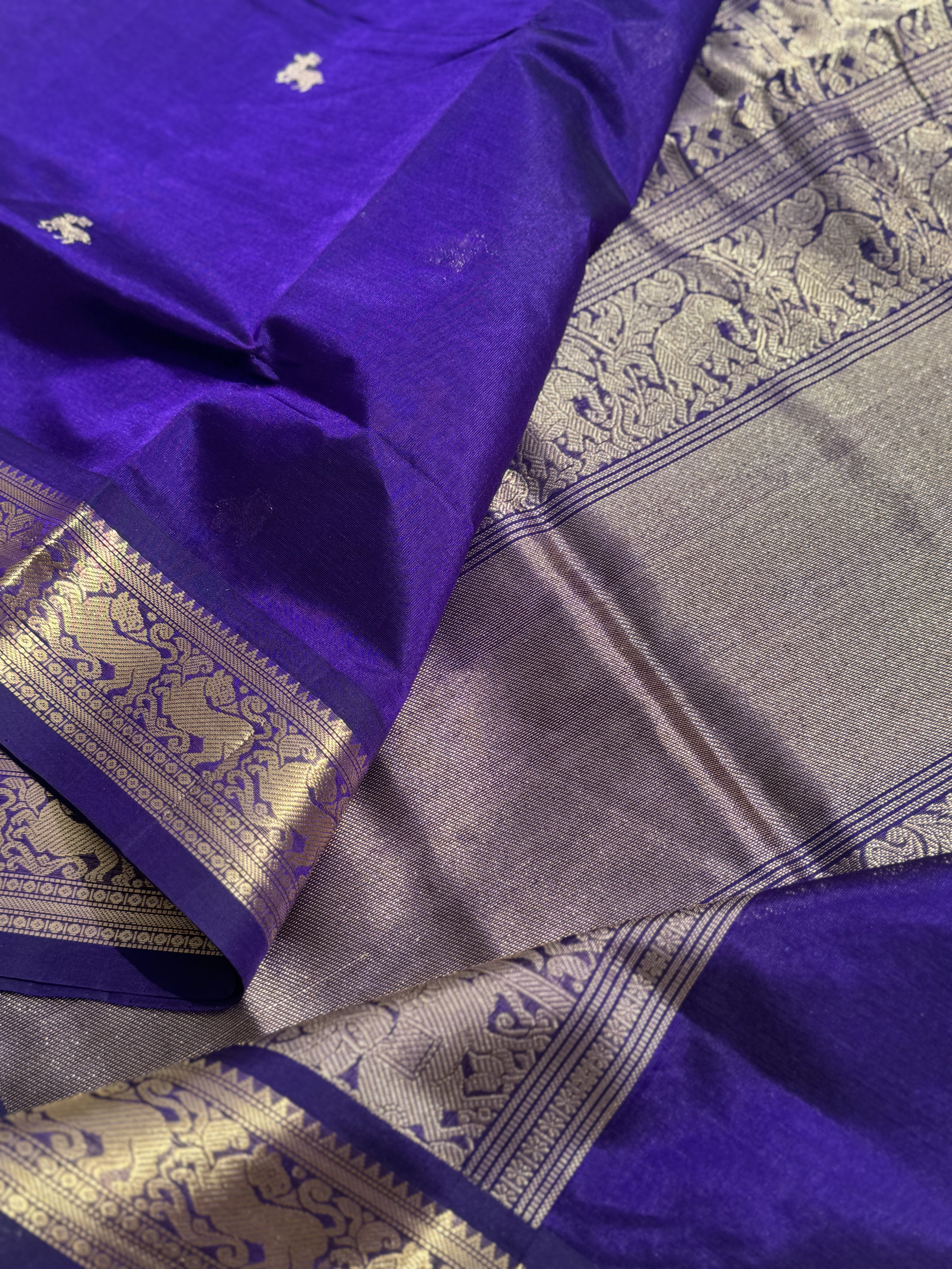 A gorgeous purple blue shade handwoven Kanchi  silk cotton saree with zari motifs