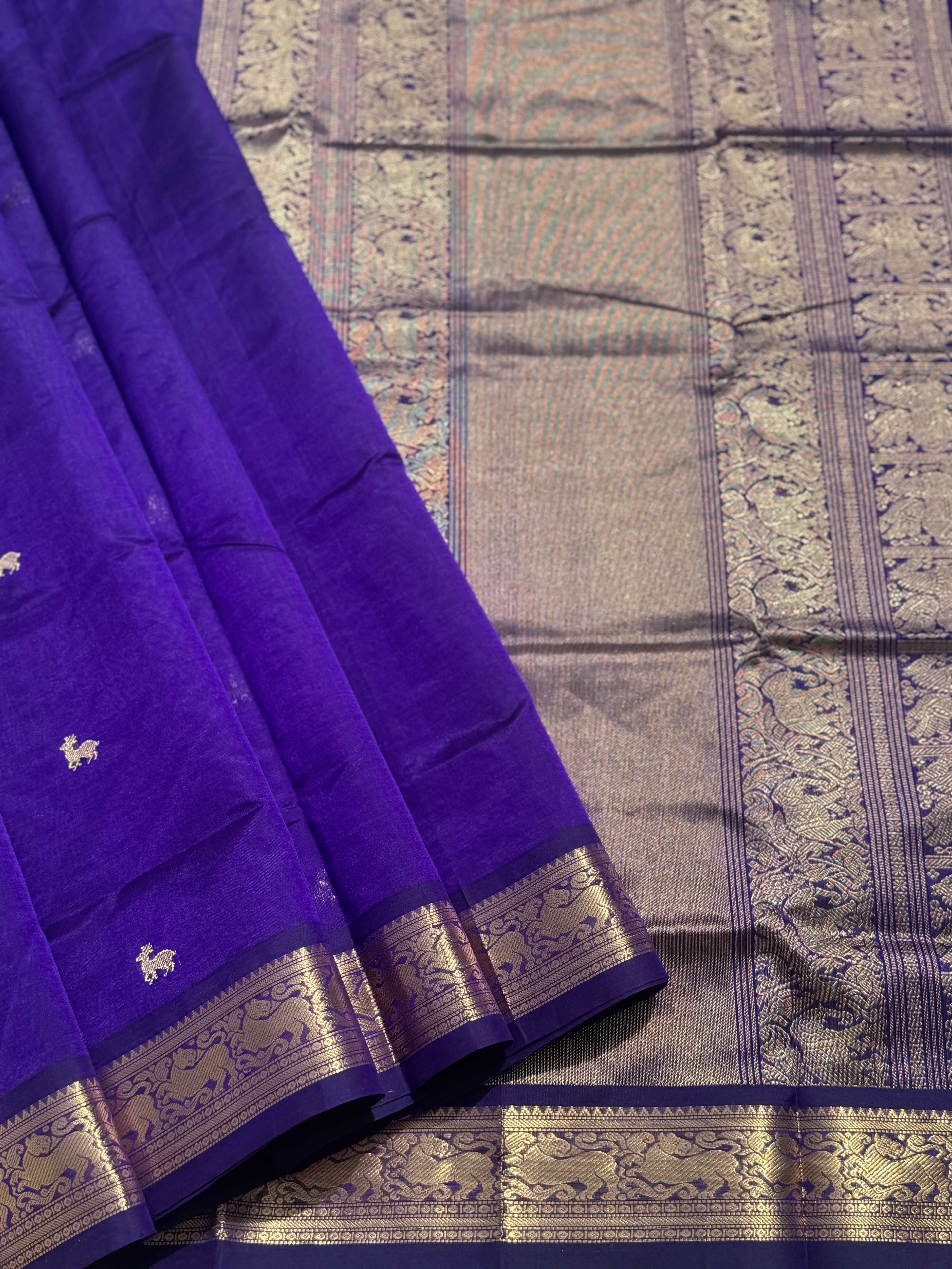 A gorgeous purple blue shade handwoven Kanchi  silk cotton saree with zari motifs