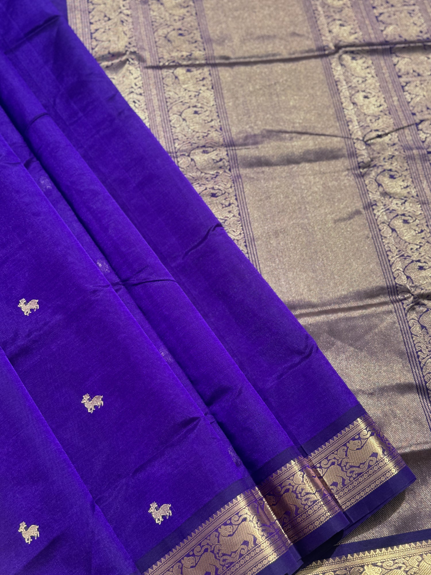 A gorgeous purple blue shade handwoven Kanchi  silk cotton saree with zari motifs