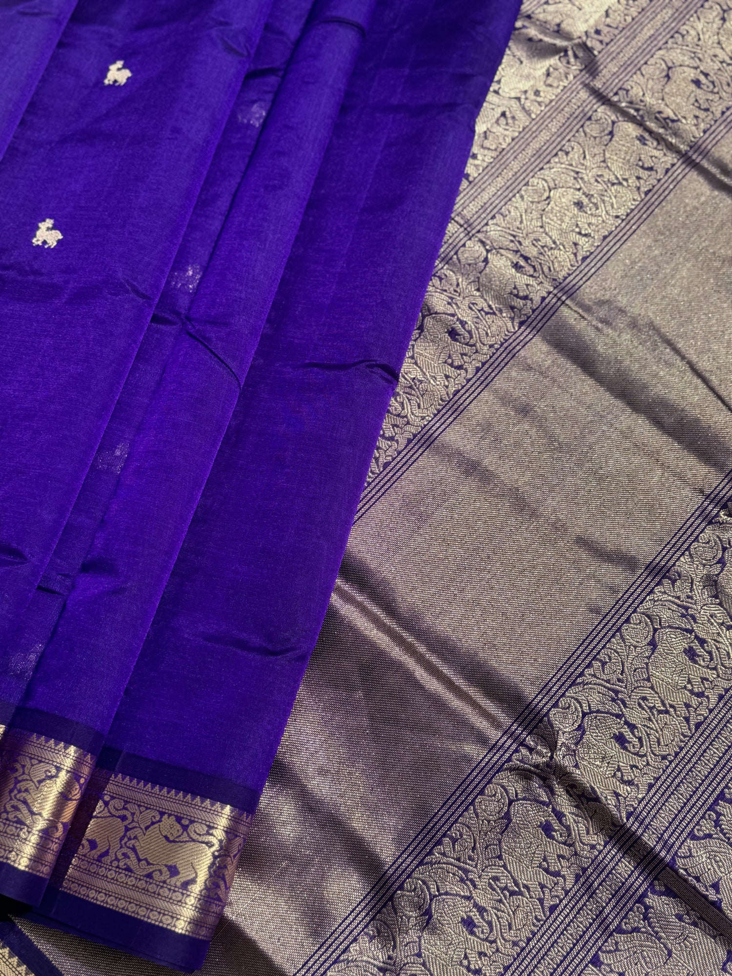 A gorgeous purple blue shade handwoven Kanchi  silk cotton saree with zari motifs