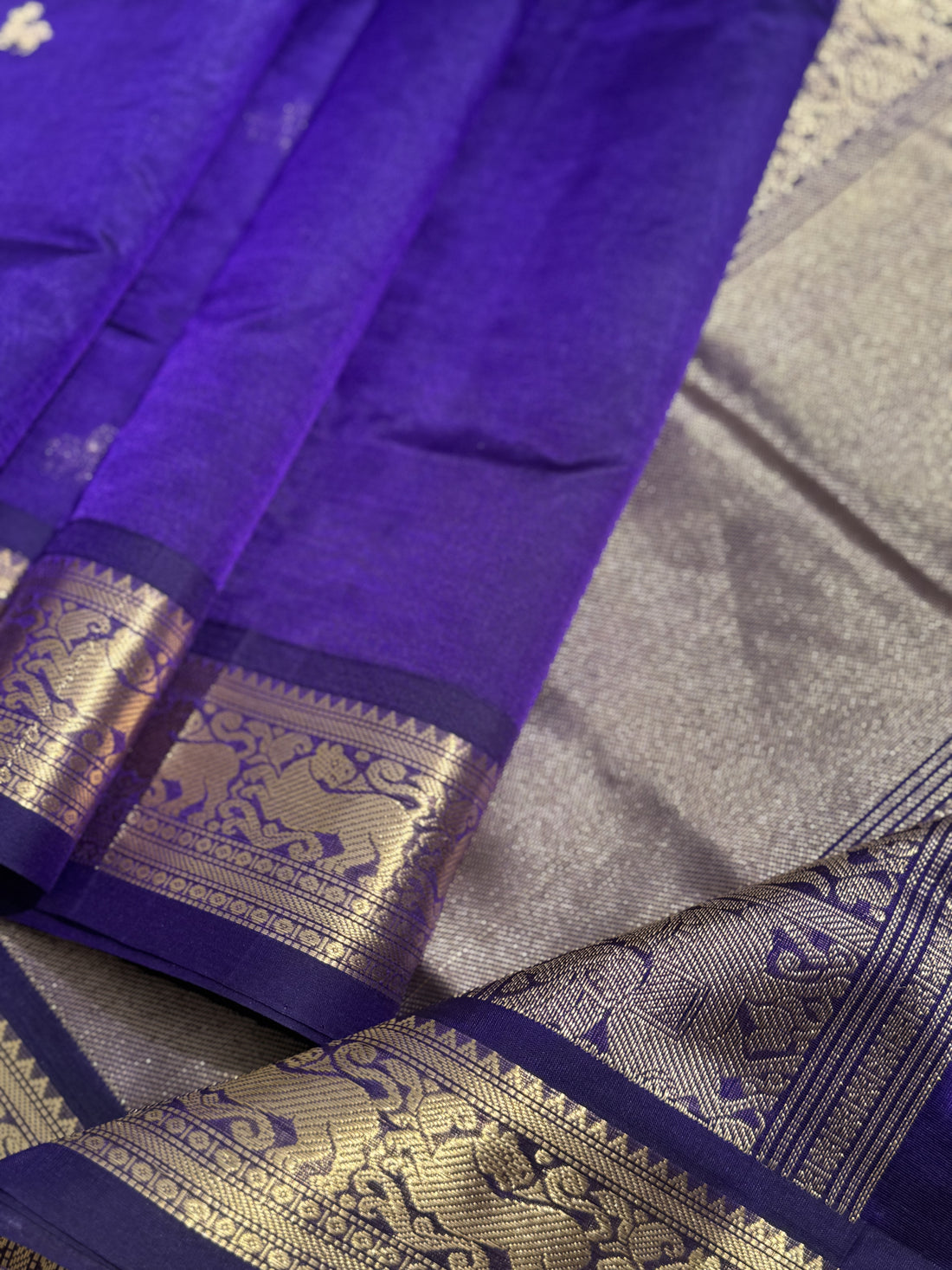A gorgeous purple blue shade handwoven Kanchi silk cotton saree with zari motifs
