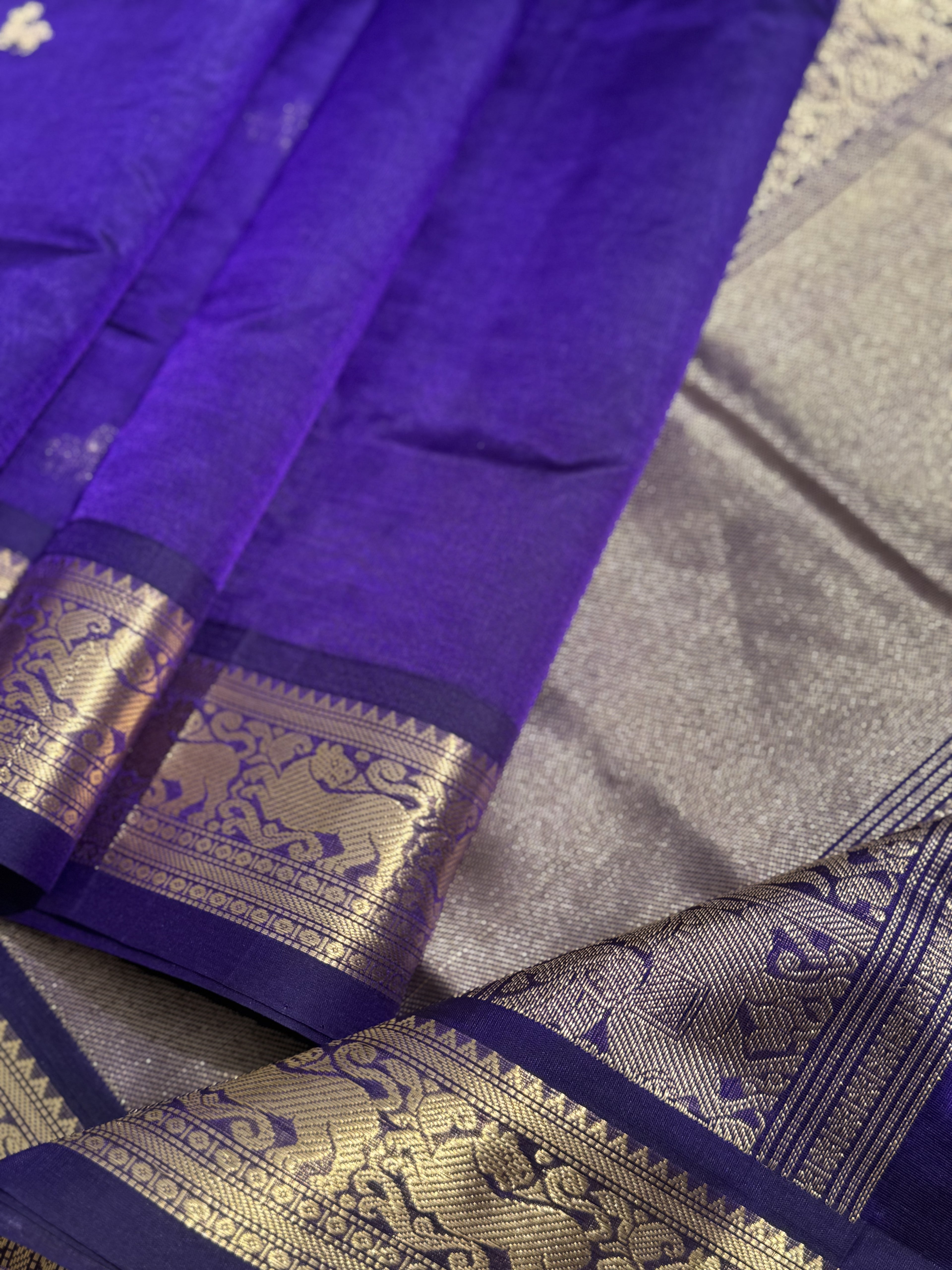 A gorgeous purple blue shade handwoven Kanchi  silk cotton saree with zari motifs