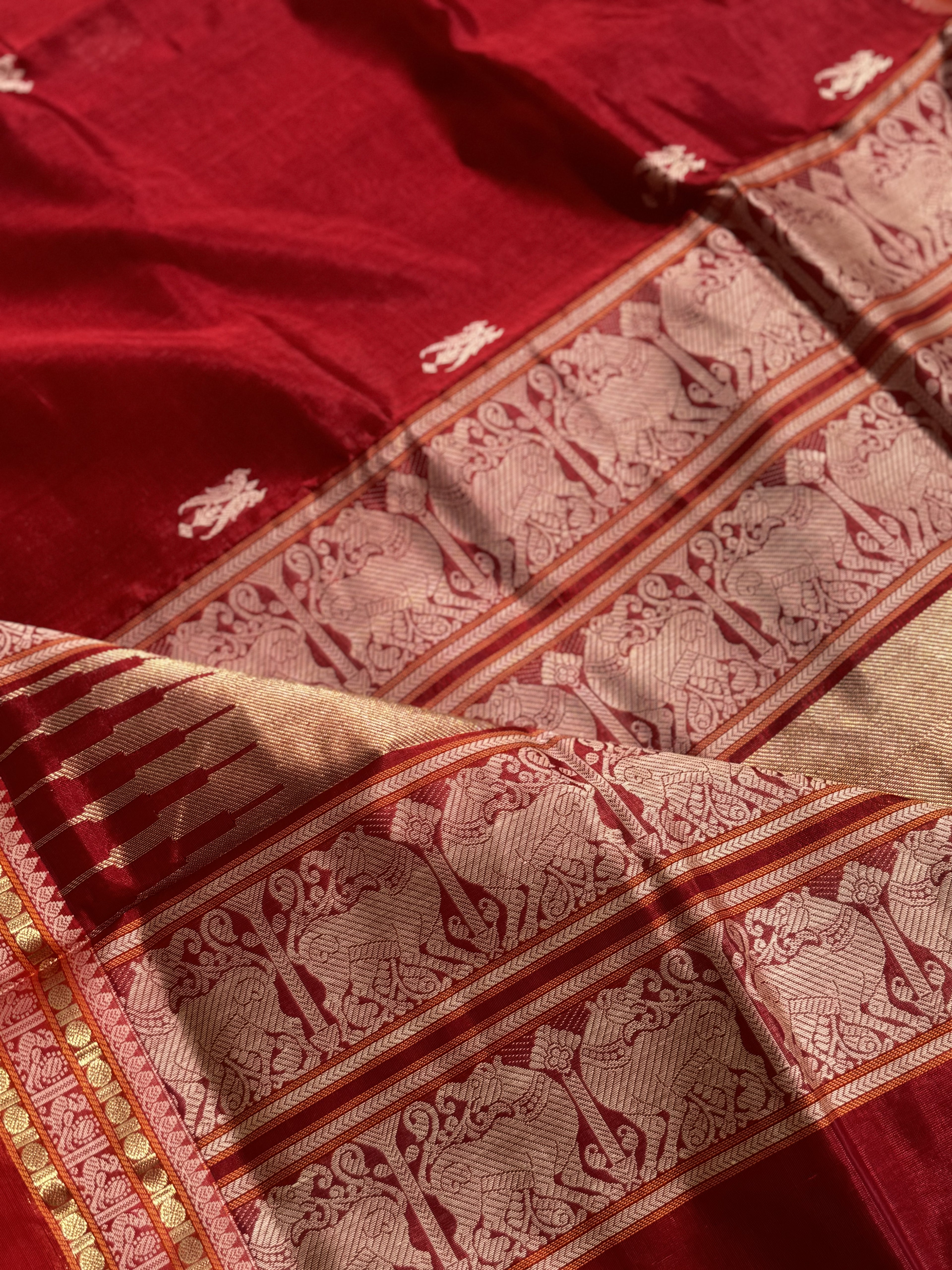 A gorgeous deep red handwoven twin parrots Kanchi silk cotton saree