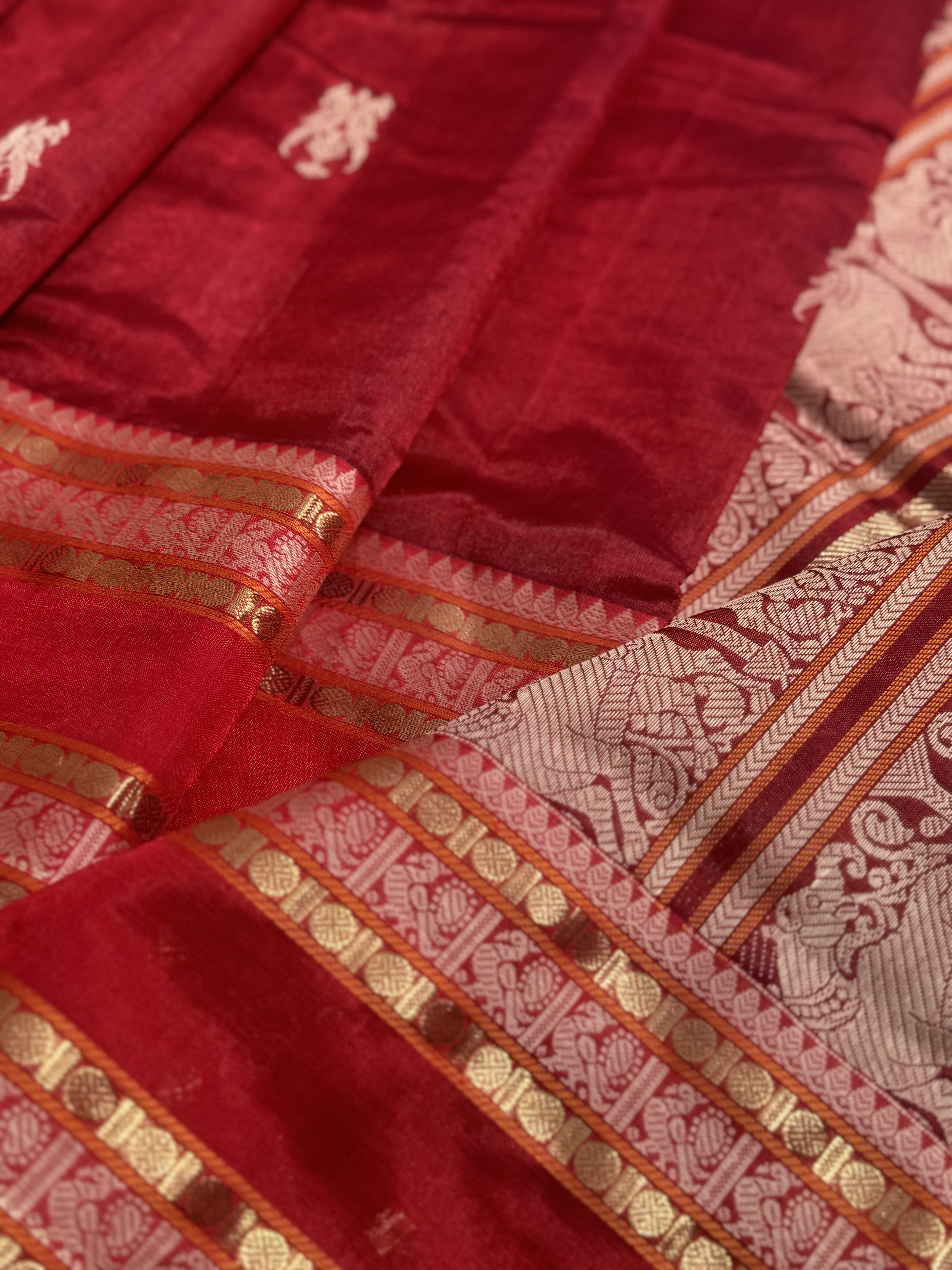 A gorgeous deep red handwoven twin parrots Kanchi silk cotton saree