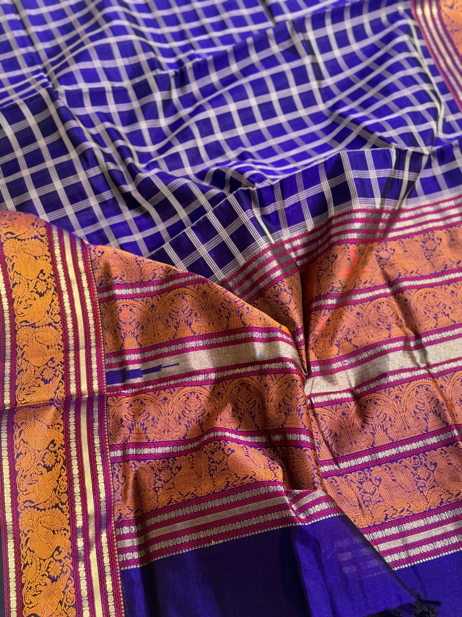 A gorgeous royal blue shade handwoven zari checks with Kanchi  silk cotton saree