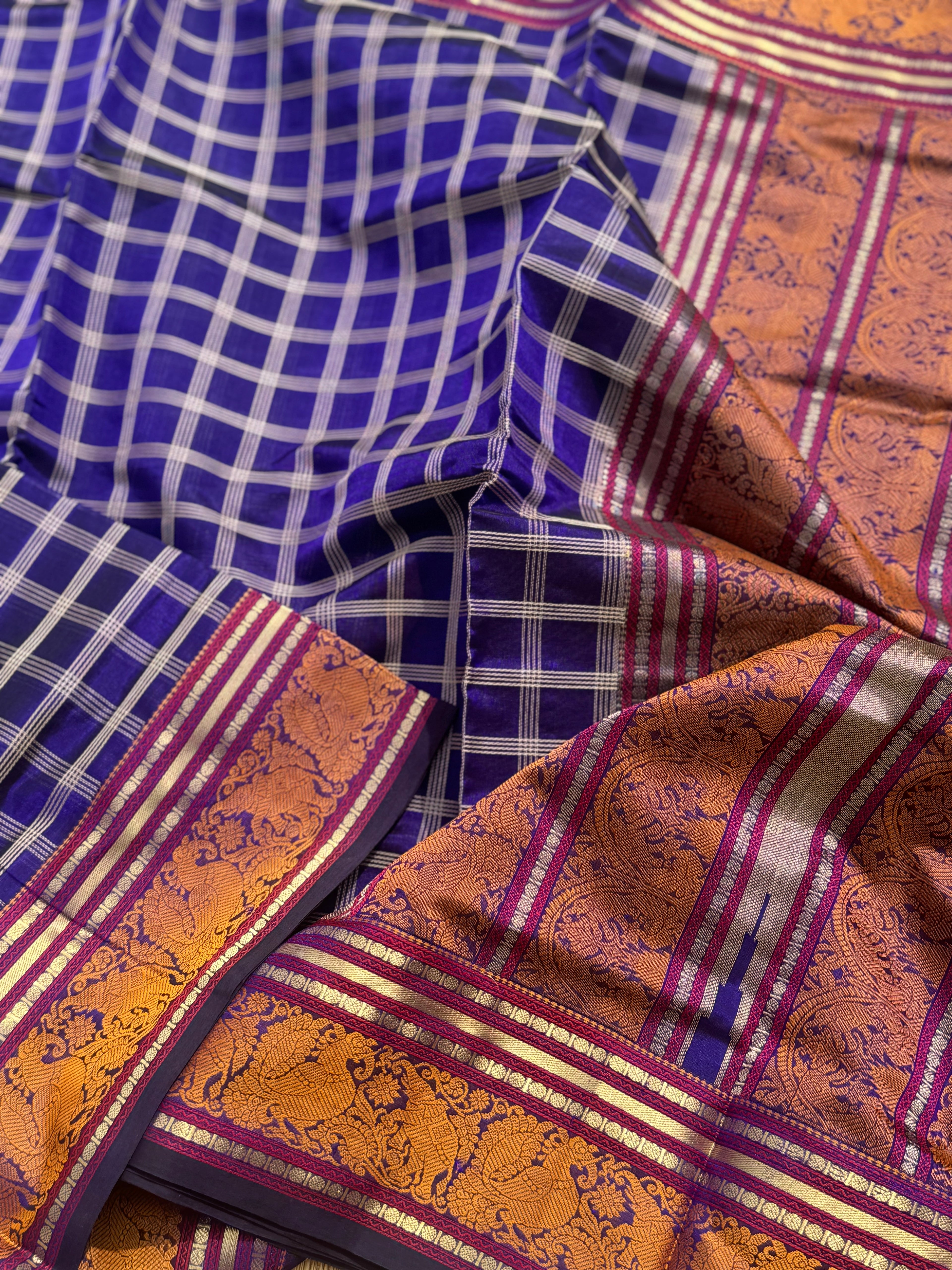 A gorgeous royal blue shade handwoven zari checks with Kanchi  silk cotton saree