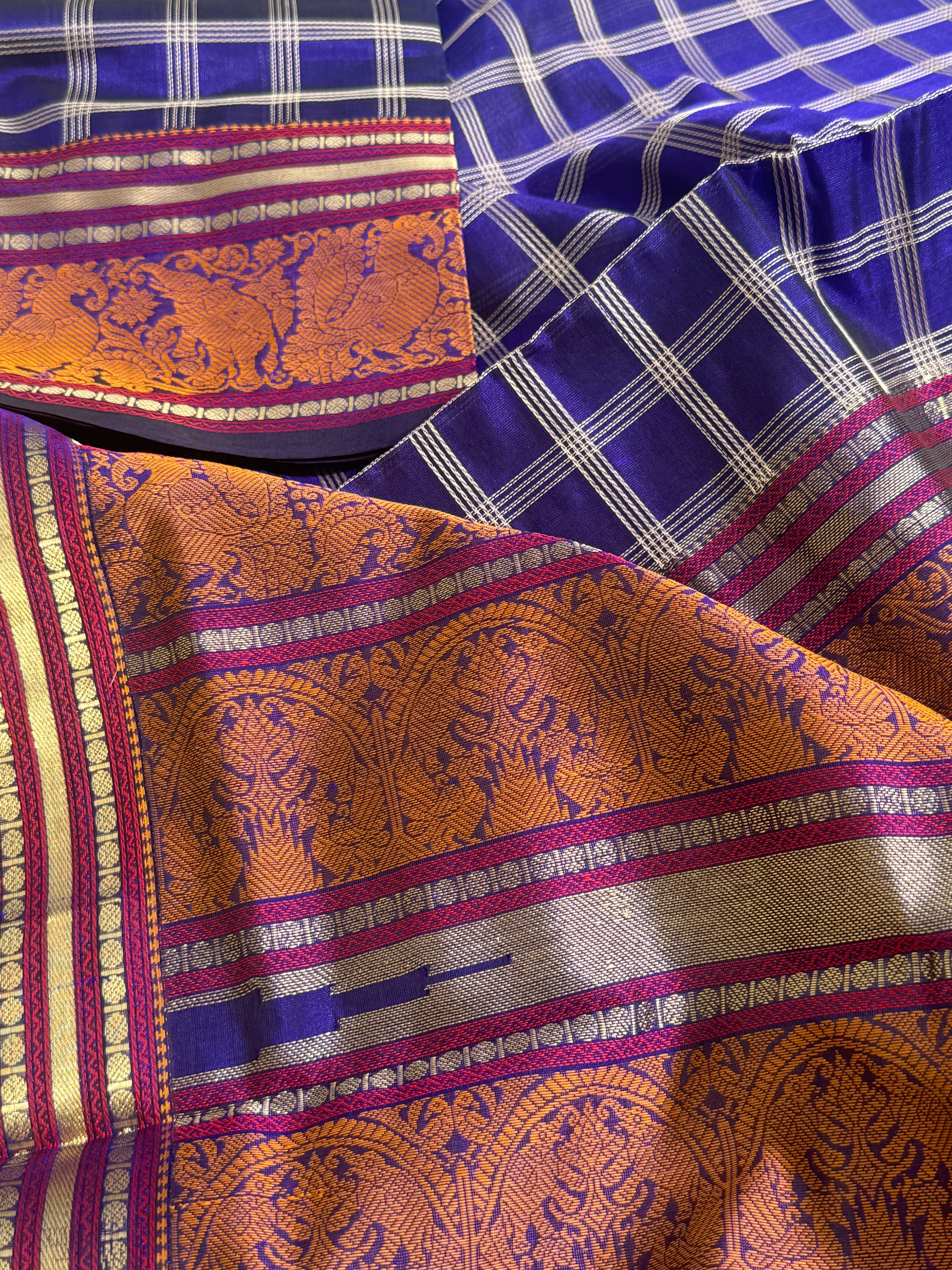 A gorgeous royal blue shade handwoven zari checks with Kanchi  silk cotton saree