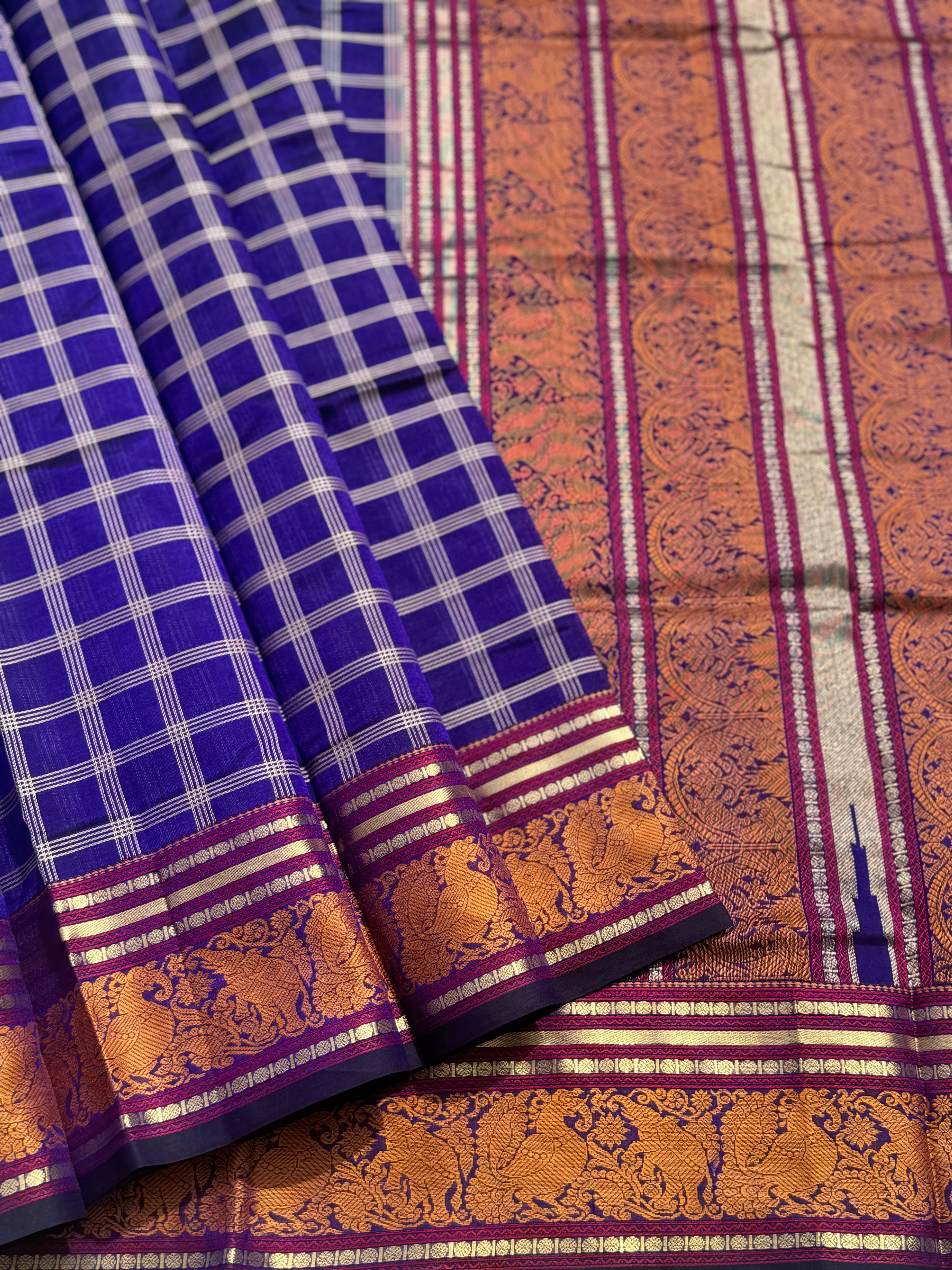 A gorgeous royal blue shade handwoven zari checks with Kanchi  silk cotton saree