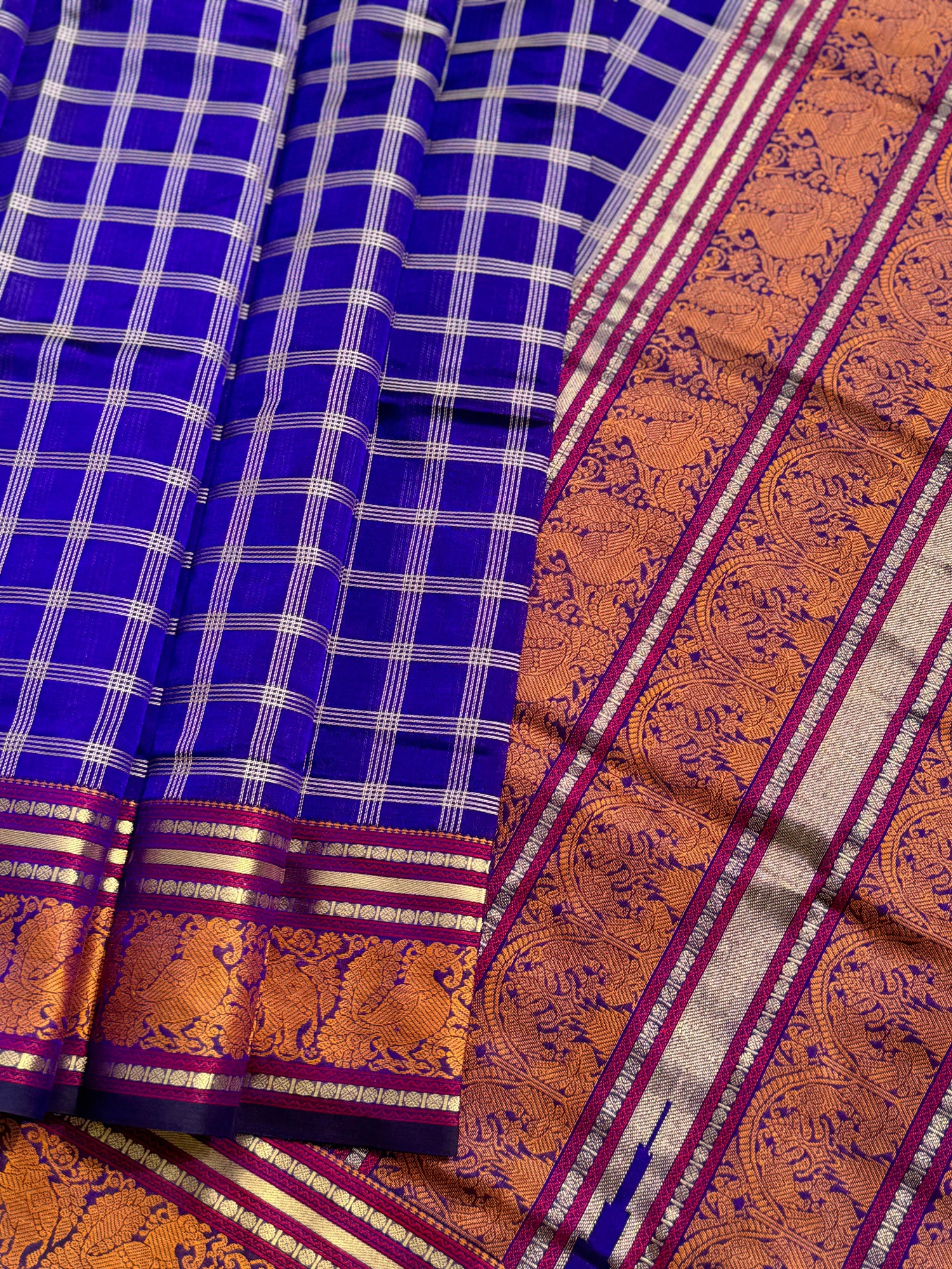 A gorgeous royal blue shade handwoven zari checks with Kanchi  silk cotton saree