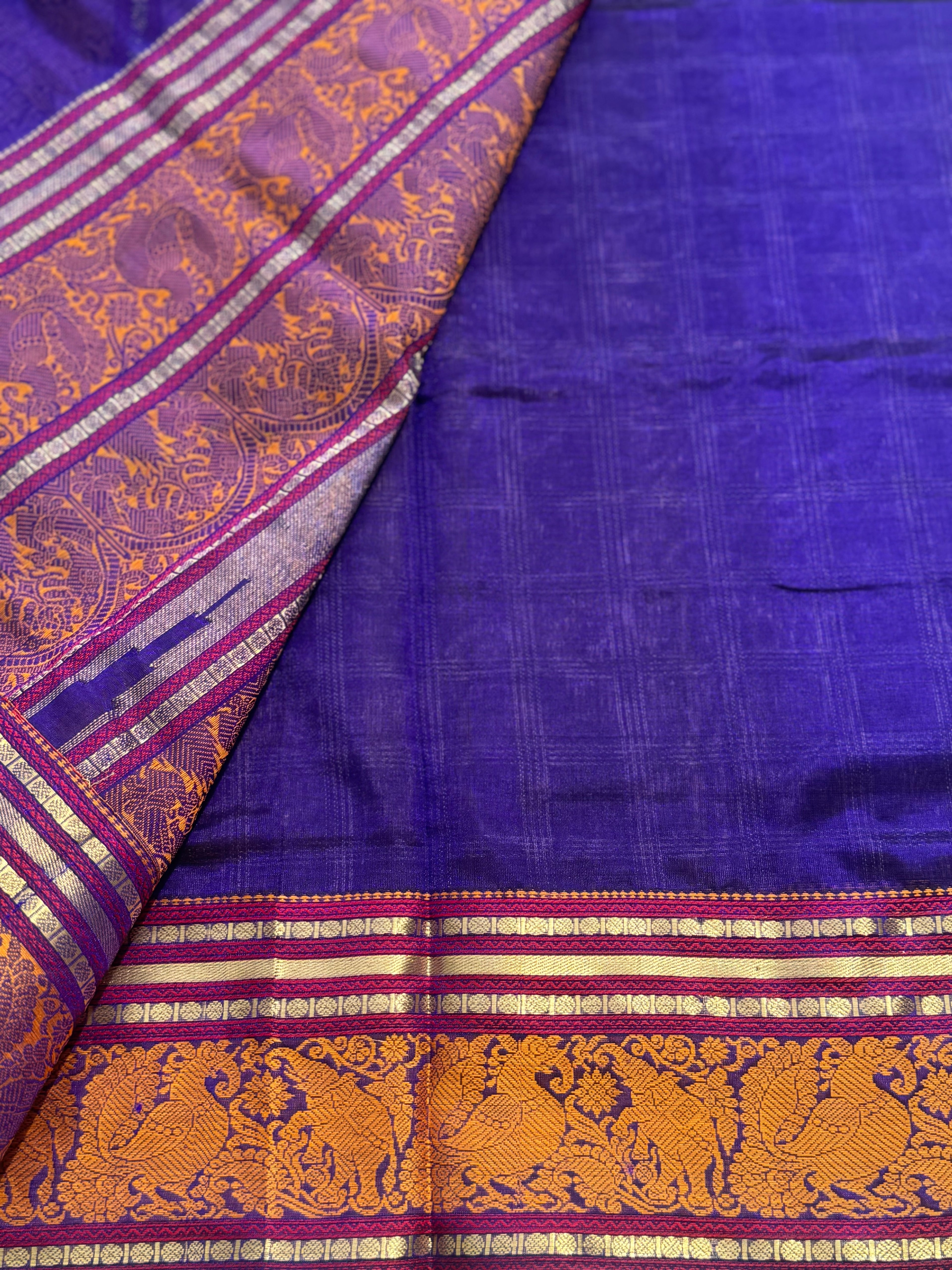 A gorgeous royal blue shade handwoven zari checks with Kanchi  silk cotton saree