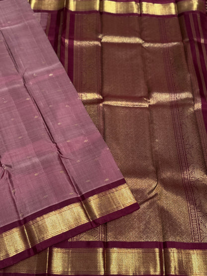A classy vintage  masterpiece Kanchivaram silk saree in deep mauve brown