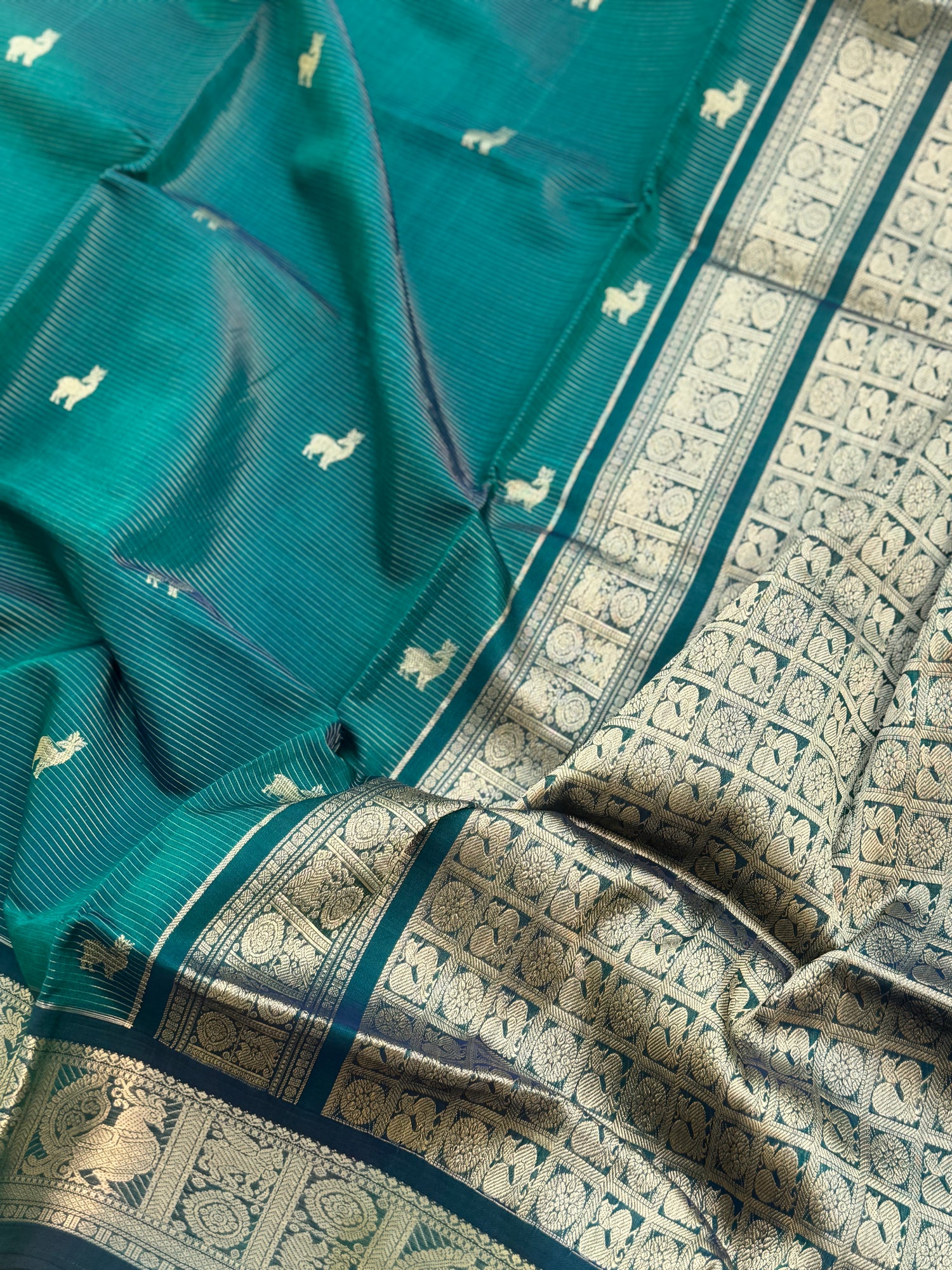 A gorgeous emerald green shade handwoven zari stripes kanchi silk cotton saree