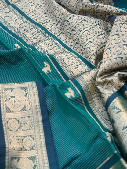 A gorgeous emerald green shade handwoven zari stripes kanchi silk cotton saree