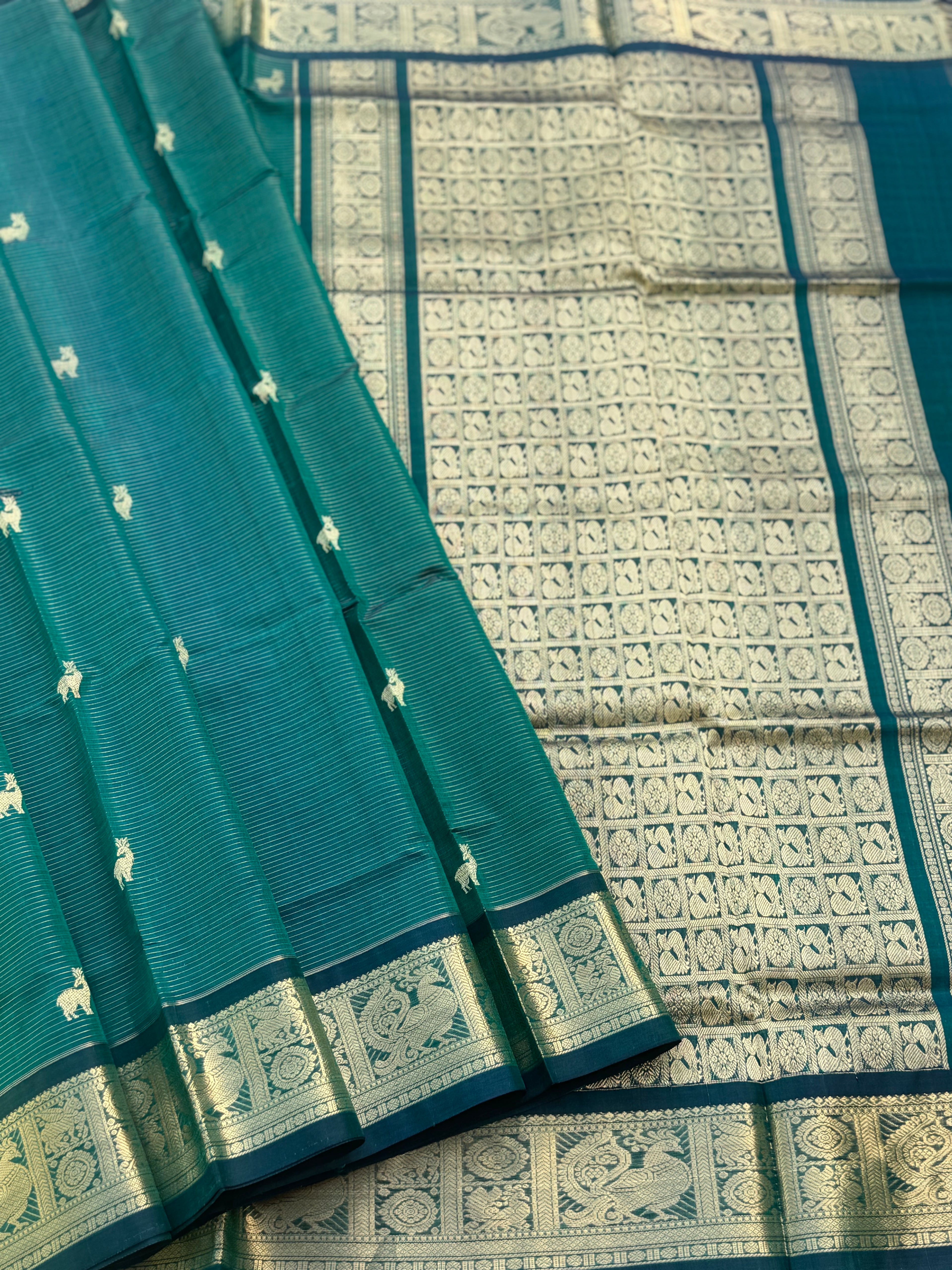 A gorgeous emerald green shade handwoven zari stripes kanchi silk cotton saree