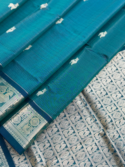 A gorgeous emerald green shade handwoven zari stripes kanchi silk cotton saree