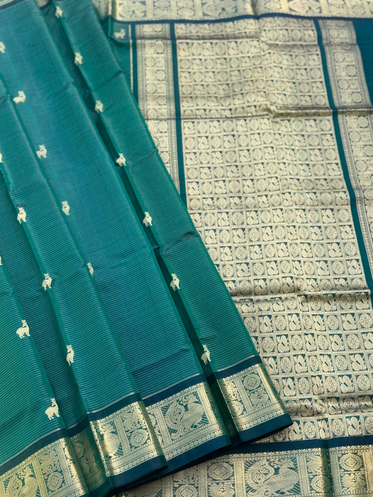 A gorgeous emerald green shade handwoven zari stripes kanchi silk cotton saree