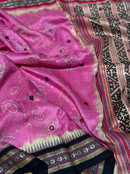 An exquisite handwoven vidharbha tussar silk saree with karvati kinar border intricately tie dyed with pink bhandhej and kutch hand embroidered
