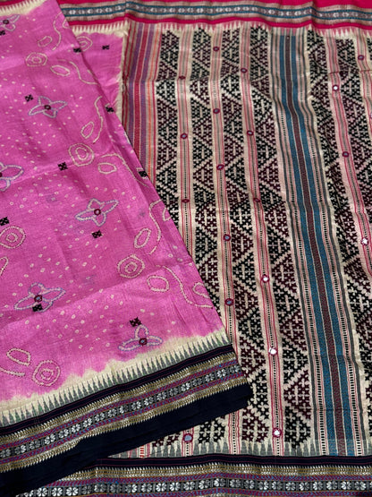 An exquisite handwoven vidharbha tussar silk saree with karvati kinar border intricately tie dyed with pink bhandhej and kutch hand embroidered