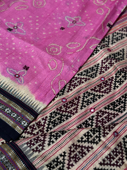 An exquisite handwoven vidharbha tussar silk saree with karvati kinar border intricately tie dyed with pink bhandhej and kutch hand embroidered