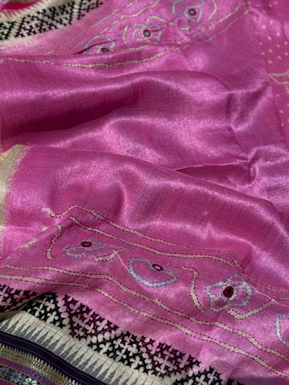 An exquisite handwoven vidharbha tussar silk saree with karvati kinar border intricately tie dyed with pink bhandhej and kutch hand embroidered