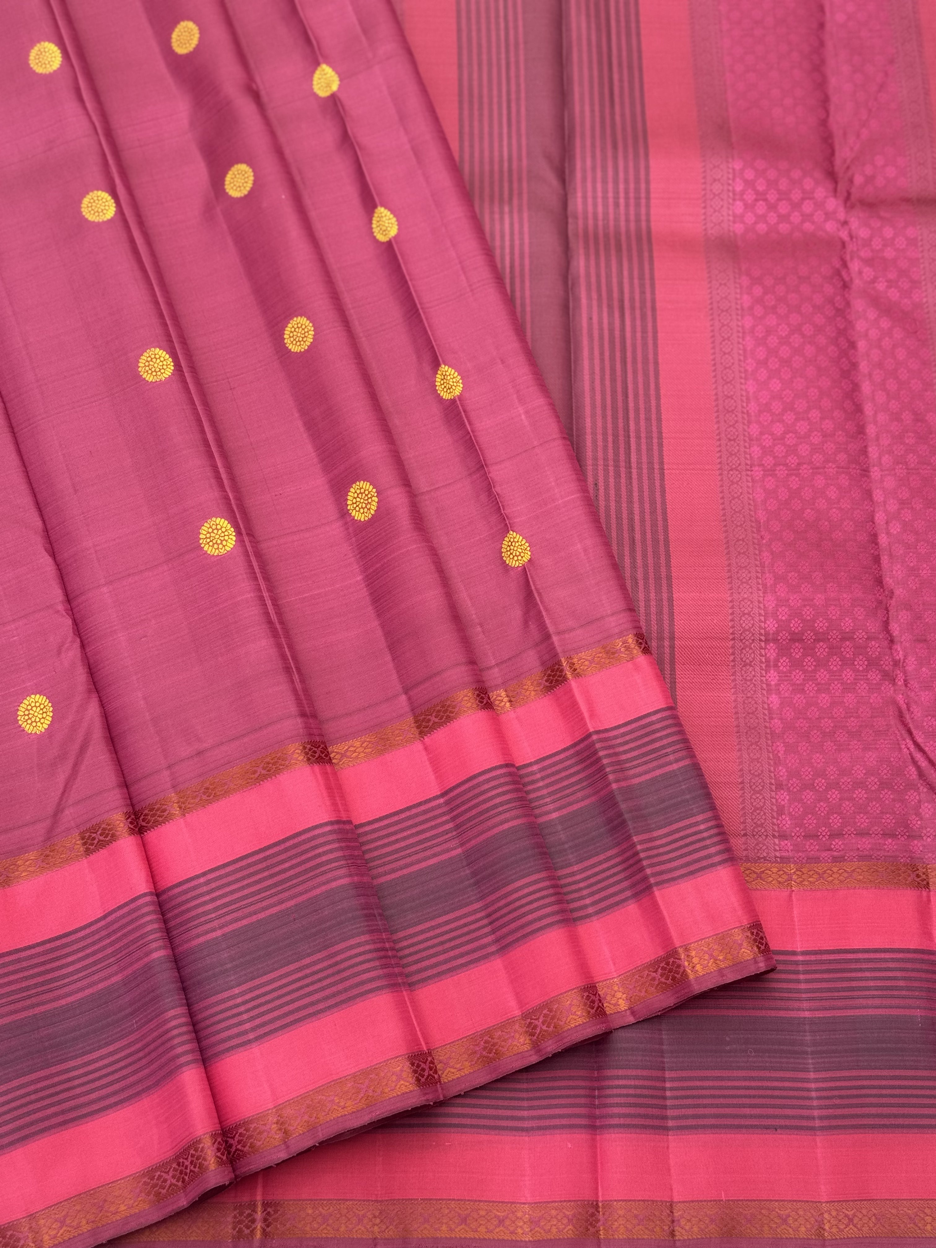 A Masterpiece no zari kanchivaram silk saree in a gorgeous mauve pink with yellow