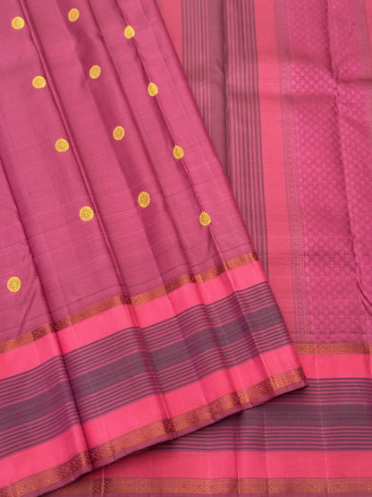 A Masterpiece no zari kanchivaram silk saree in a gorgeous mauve pink with yellow