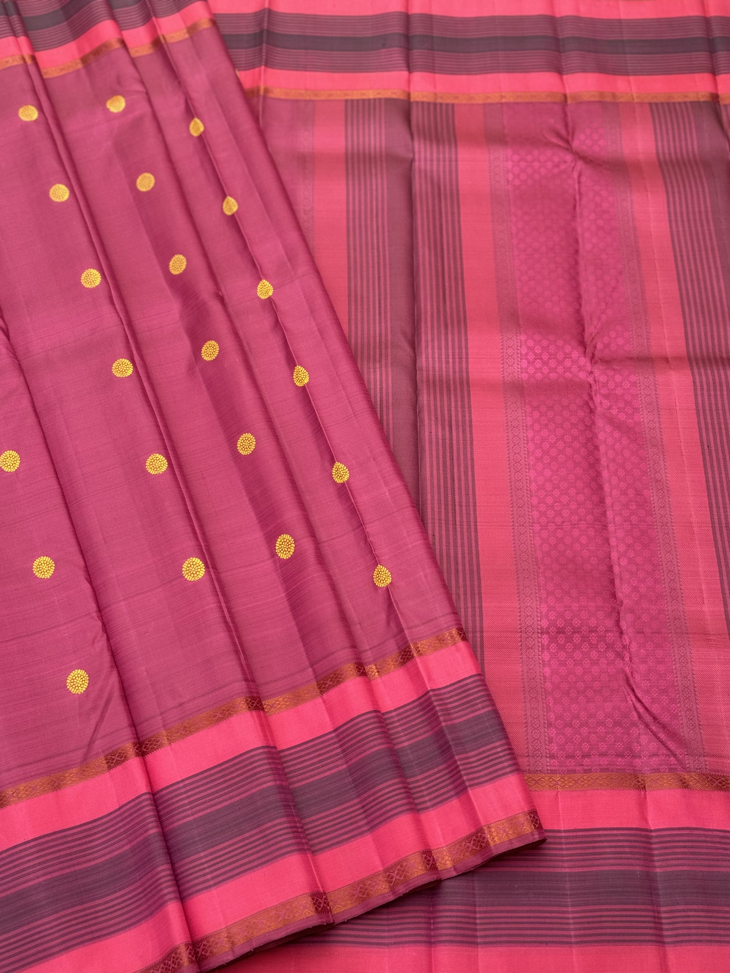 A Masterpiece no zari kanchivaram silk saree in a gorgeous mauve pink with yellow