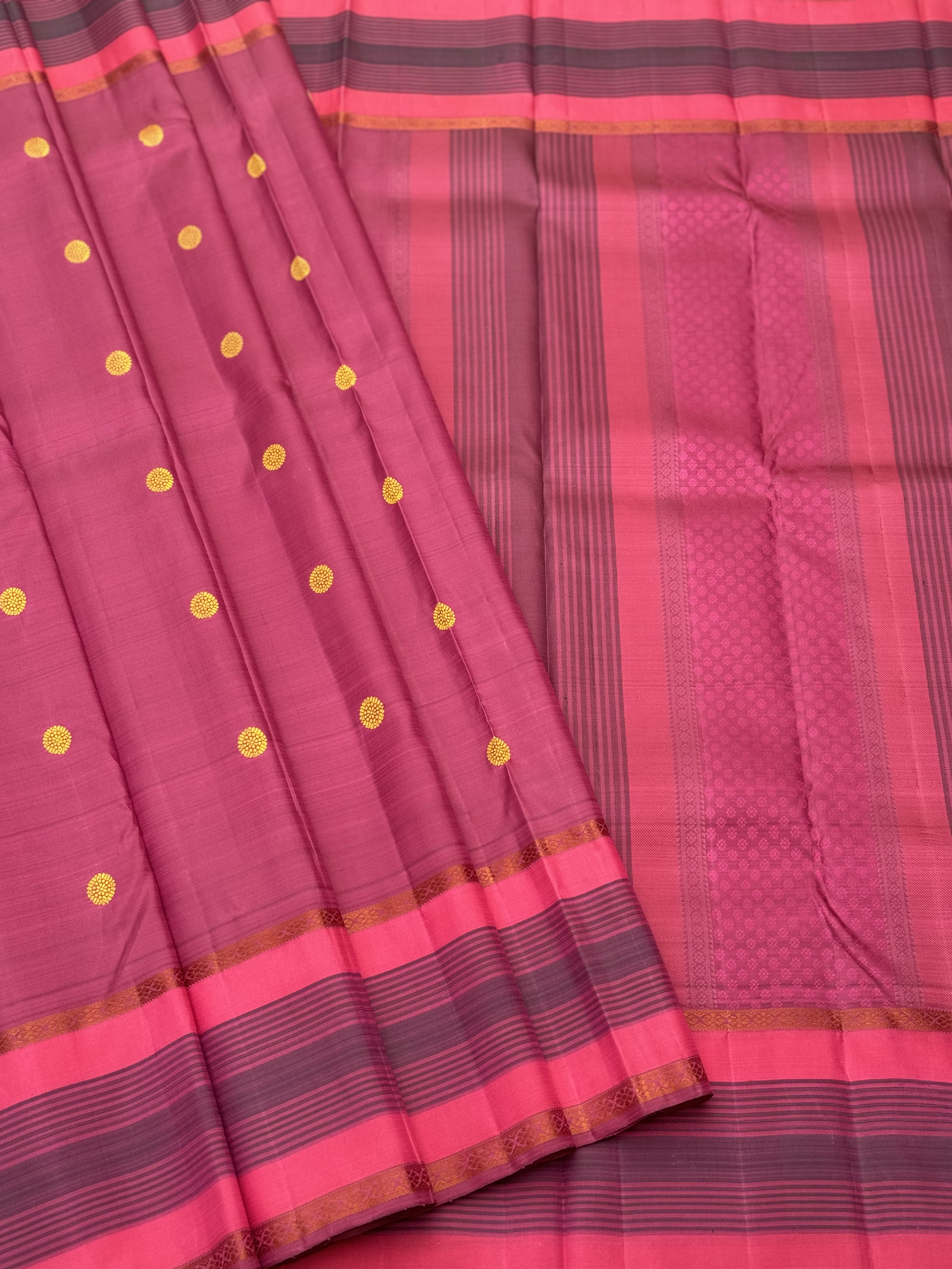 A Masterpiece no zari kanchivaram silk saree in a gorgeous mauve pink with yellow