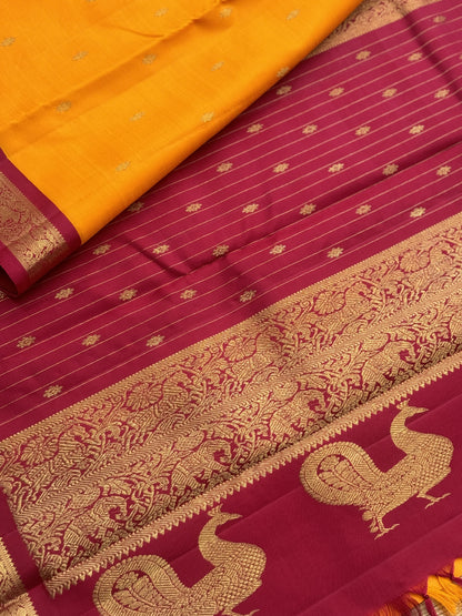 A stunner Masterpiece kanchivaram korvai silk saree in Mango yellow with arakku
