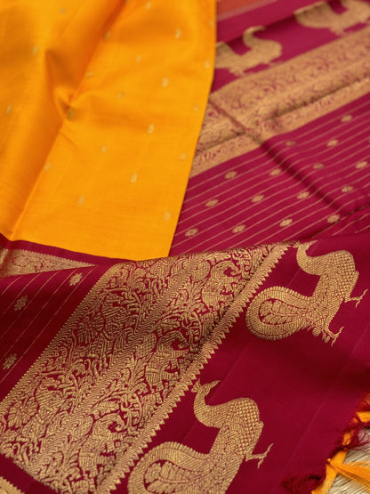 A stunner Masterpiece kanchivaram korvai silk saree in Mango yellow with arakku