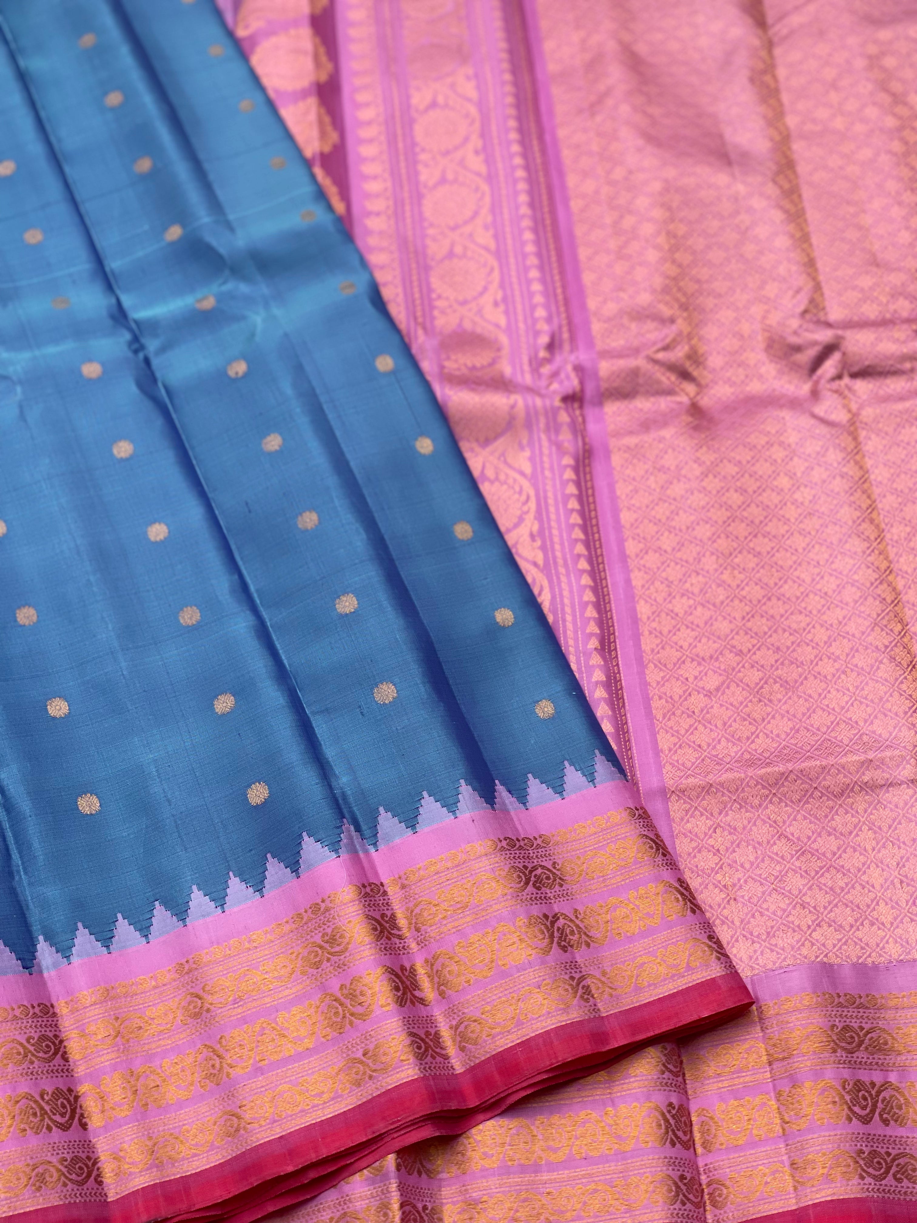 A gorgeous Peacock blue with pink Gadwal Silk saree