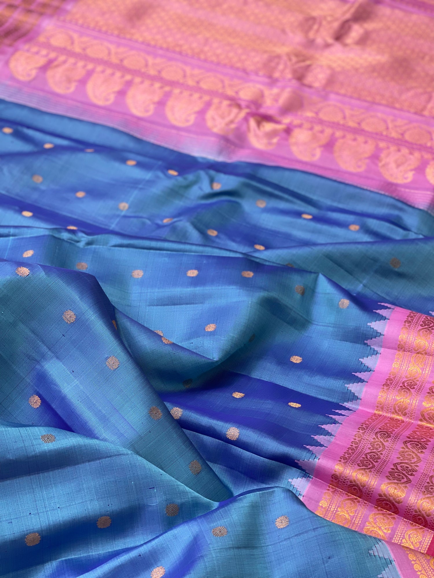 A gorgeous Peacock blue with pink Gadwal Silk saree