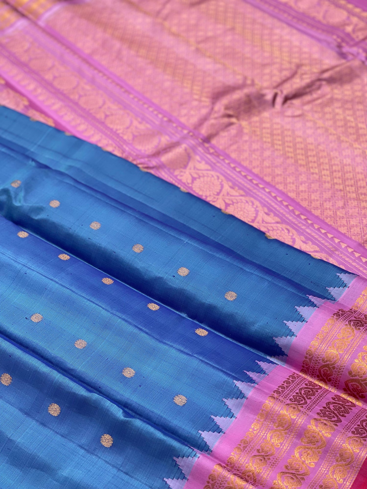 A gorgeous Peacock blue with pink Gadwal Silk saree