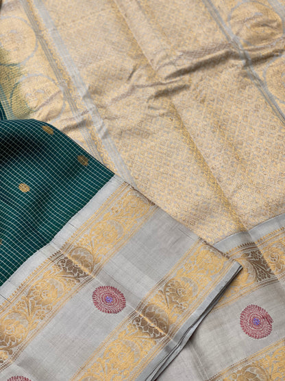 An Elegant Bottlegreen Gadwal silk with Meenakari work Kanchi border